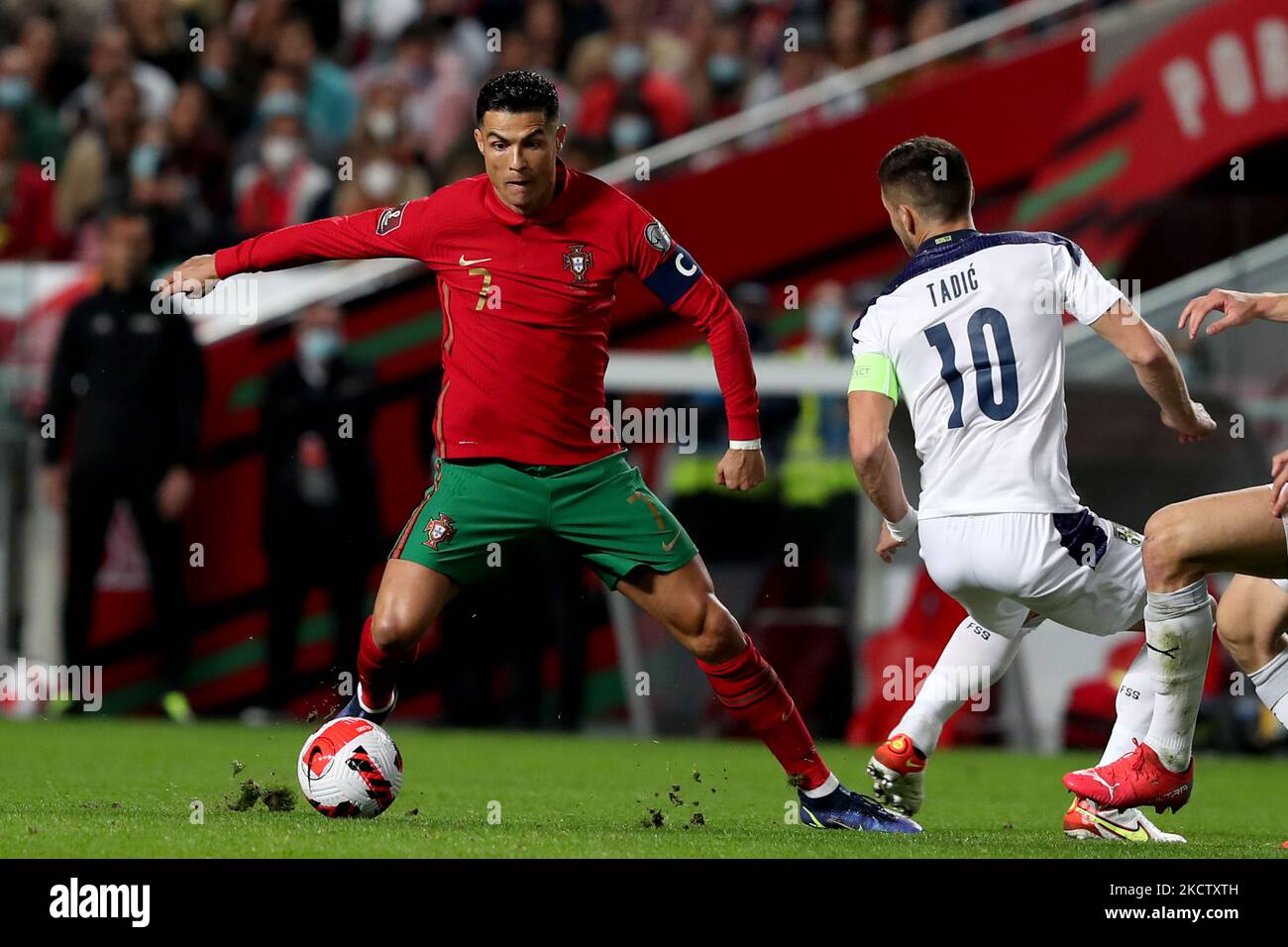 Portugal's forward Cristiano Ronaldo (L) vies with Serbia's midfielder Dusan Tadic during the FIFA World Cup Qatar 2022 qualification group A football match between Portugal and Serbia at the Luz stadium in Lisbon, Portugal, on November 14, 2021. (Photo by Pedro FiÃºza/NurPhoto) Stock Photo