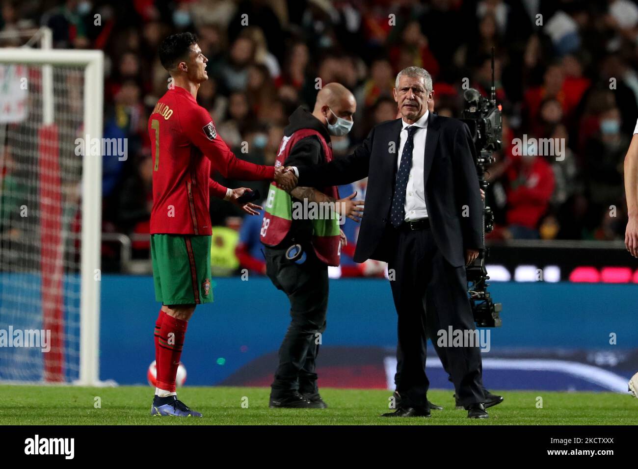 Portugal's forward Cristiano Ronaldo (L) reacts with Portugal's head coach Fernando Santos at the end of the FIFA World Cup Qatar 2022 qualification group A football match between Portugal and Serbia at the Luz stadium in Lisbon, Portugal, on November 14, 2021. (Photo by Pedro FiÃºza/NurPhoto) Stock Photo