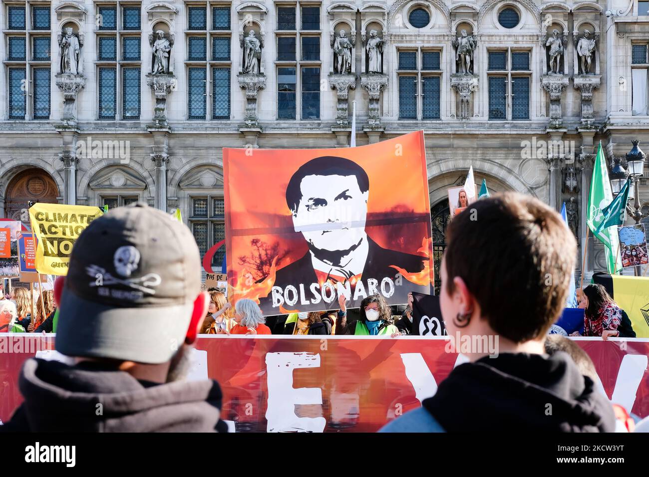 The giant portrait of Jair Bolsonaro in front of a burning forest, in