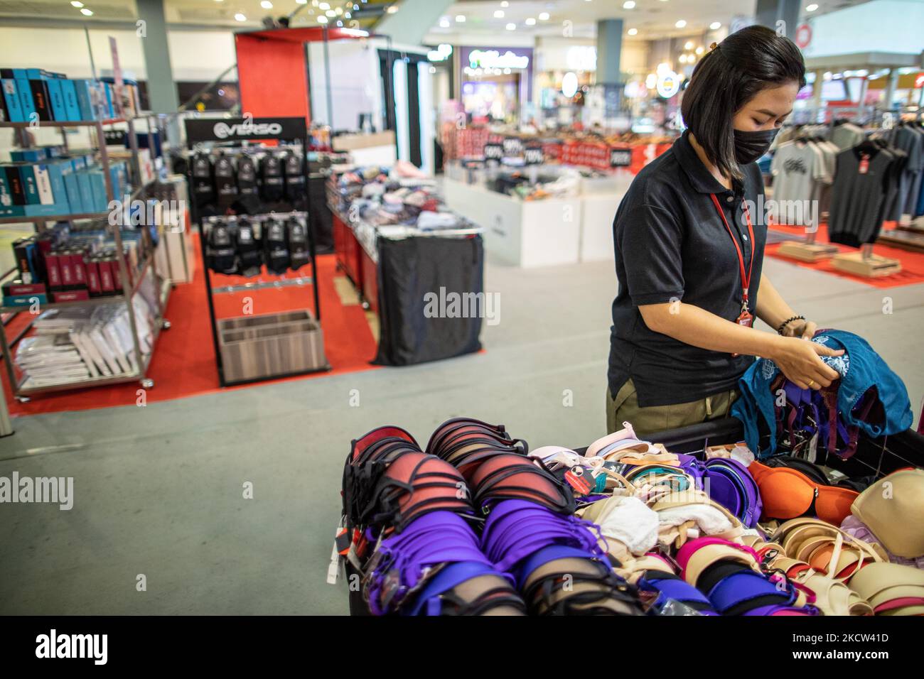 South Tangerang, Banten, Indonesia, November 18, 2021: An employee sorts  women's underwear for sale at the Teras Kota Mall, South Tangerang, Banten,  Indonesia. Malls in Indonesia are showing a normal situation again