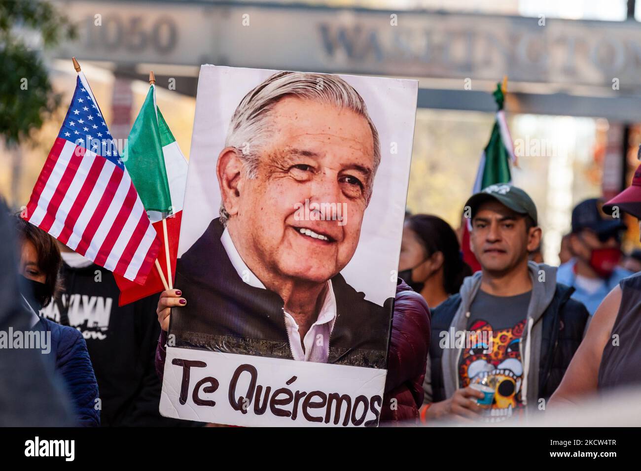 A protester carries a photo of Mexican President Andrés Manuel Lopez Obrador with the words, 'Te quéremos' ('We love you') during a march celebrating the summit of President López Obrador with President Joe Biden and Canadian Prime Minister Justin Trudeau. Demonstrators are demanding immigration reform while also cheering on the Mexican president. (Photo by Allison Bailey/NurPhoto) Stock Photo