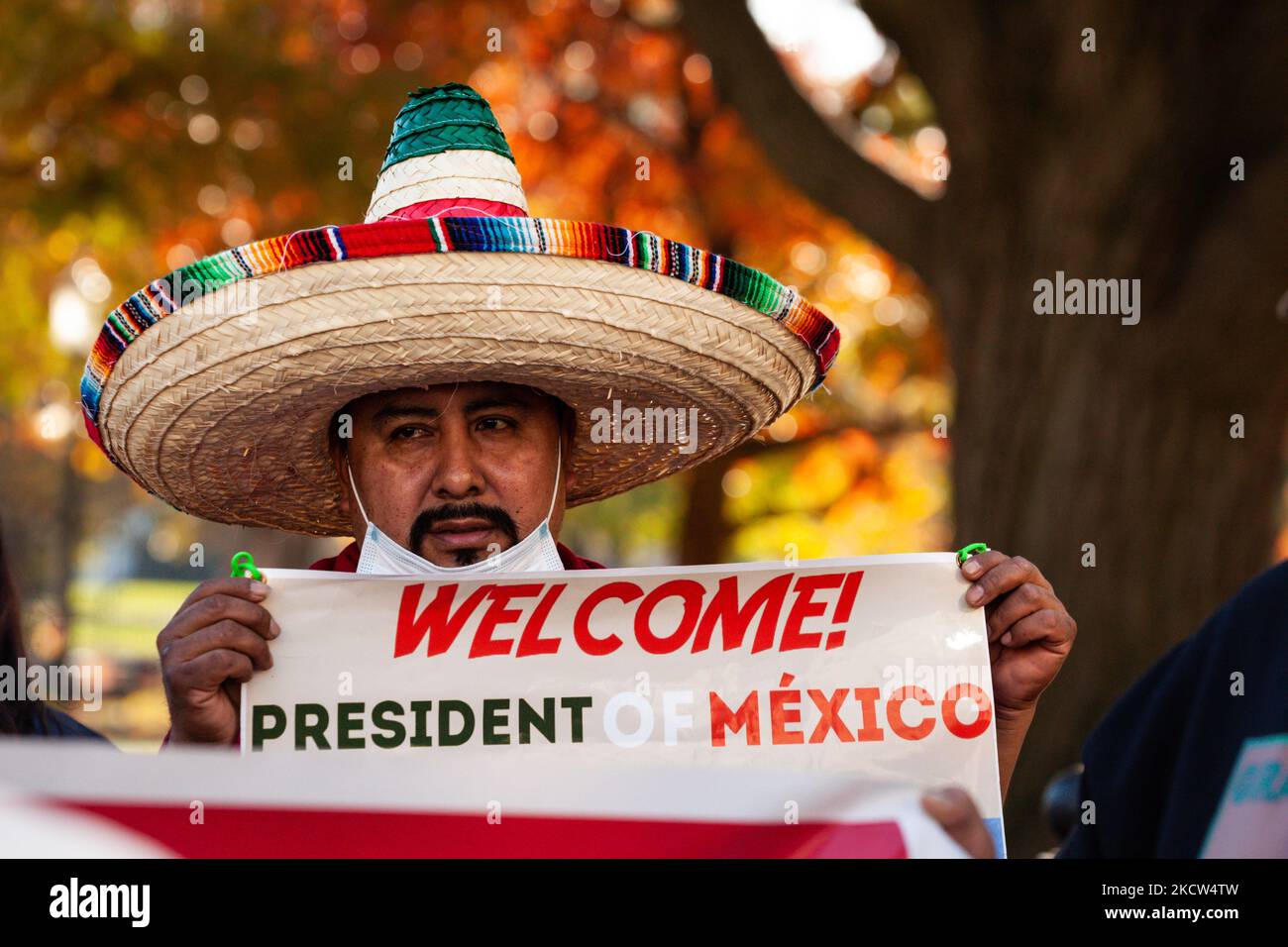A protester celebrates the summit of President Andrés Manuel López Obrador of Mexico with President Joe Biden and Canadian Prime Minister Justin Trudeau at the White House. Demonstrators are demanding immigration reform while also cheering on the Mexican president. (Photo by Allison Bailey/NurPhoto) Stock Photo