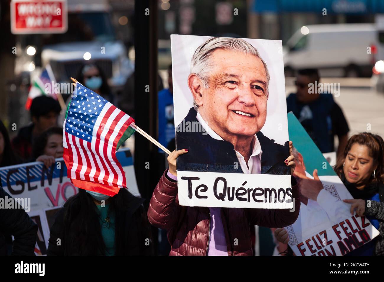 A protester carries a photo of Mexican President Andrés Manuel Lopez Obrador with the words, 'Te quéremos' ('We love you) during a march celebrating the summit of President López Obrador with President Joe Biden and Canadian Prime Minister Justin Trudeau. Demonstrators are demanding immigration reform while also cheering on the Mexican president. (Photo by Allison Bailey/NurPhoto) Stock Photo