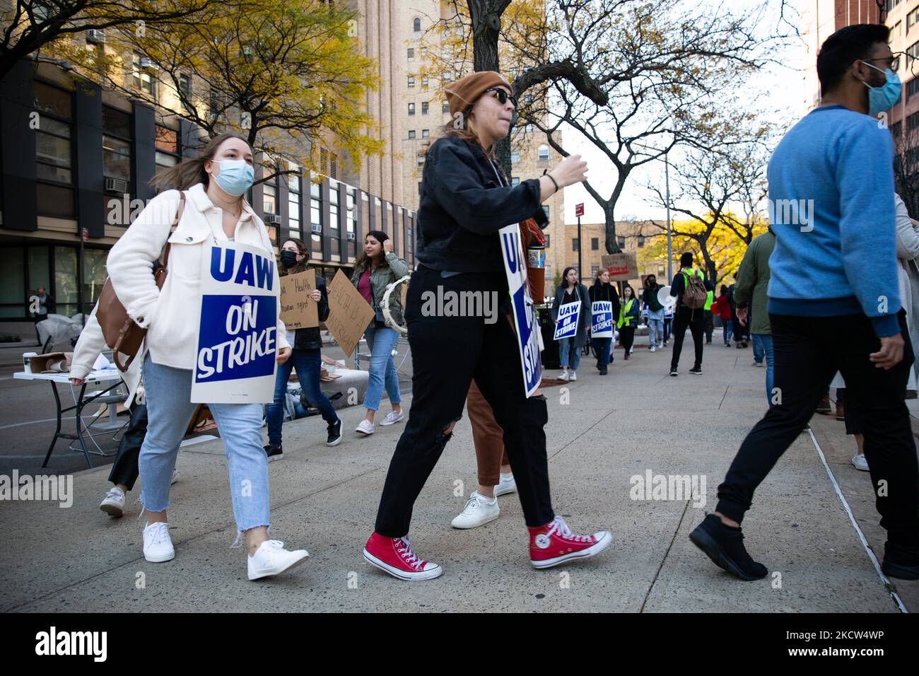 Dozens of union members affiliated with the Student Workers of Columbia ...