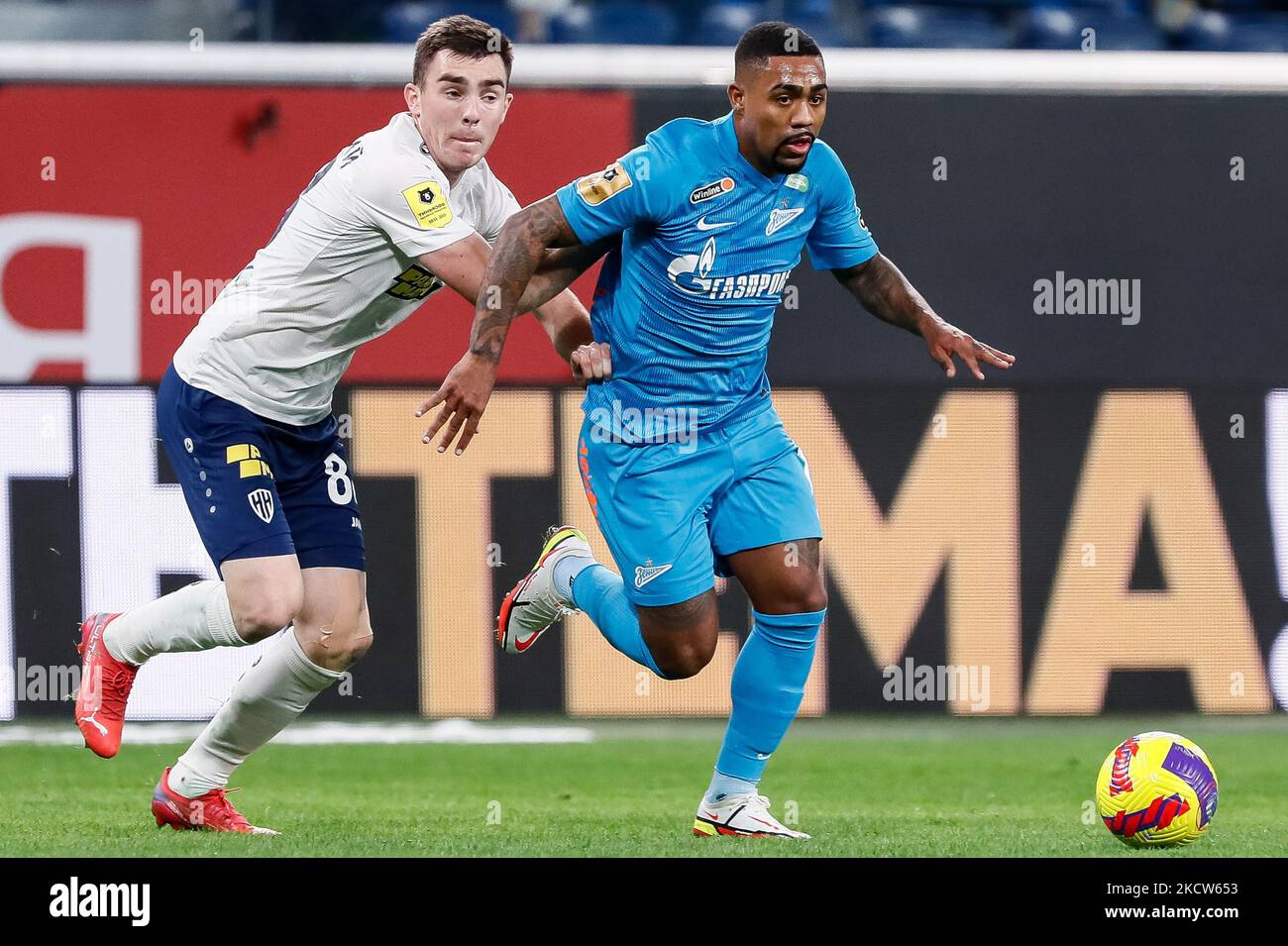 Malcom (R) of Zenit St. Petersburg and Ilya Berkovsky of Nizhny Novgorod vie for the ball during the Russian Premier League match between FC Zenit Saint Petersburg and FC Nizhny Novgorod on November 19, 2021 at Gazprom Arena in Saint Petersburg, Russia. (Photo by Mike Kireev/NurPhoto) Stock Photo