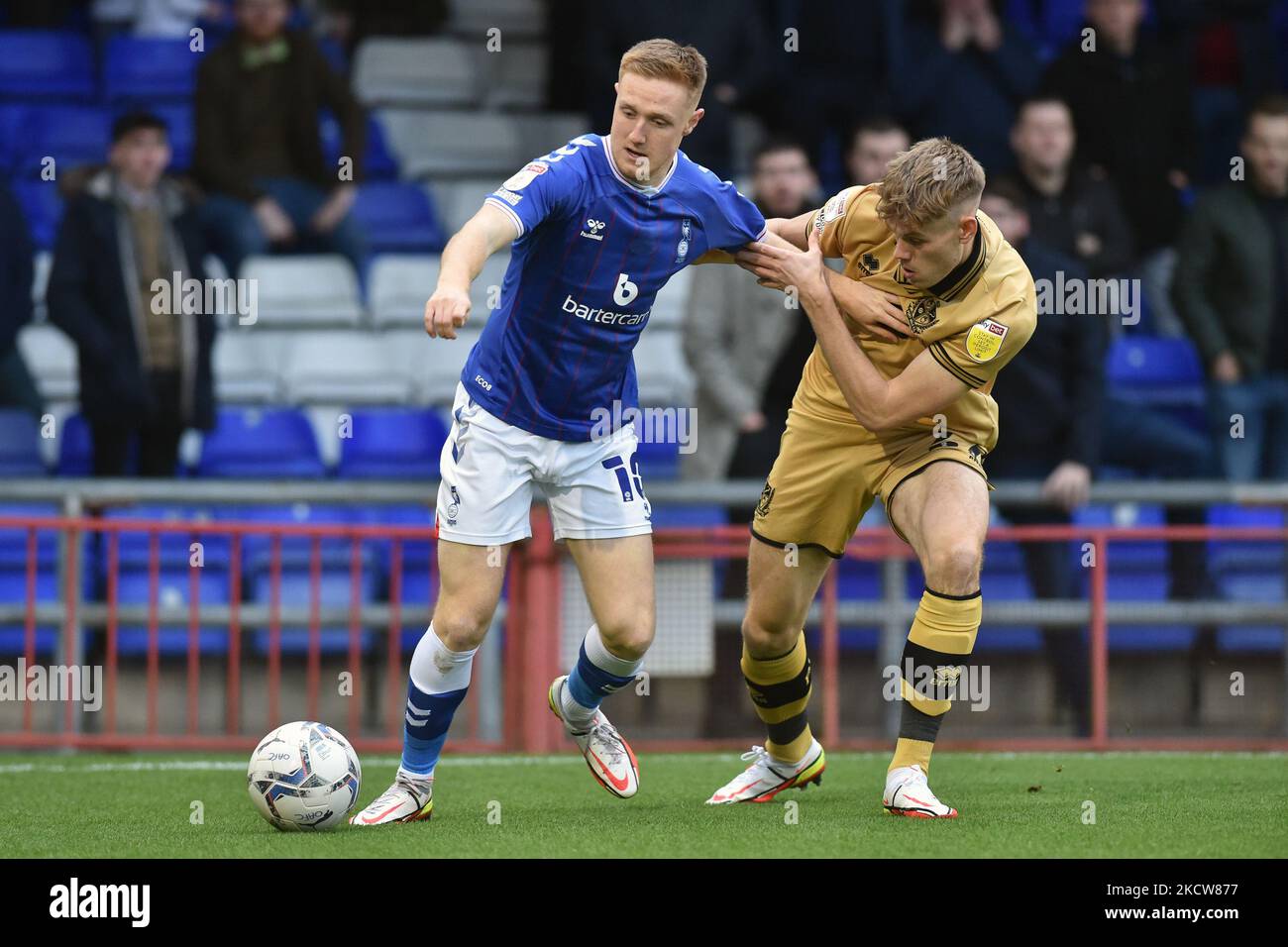 Oldham Athletic's Davis Keillor-Dunn tussles with Lewis Cass of Port Vale during the Sky Bet League 2 match between Oldham Athletic and Port Vale at Boundary Park, Oldham on Saturday 20th November 2021. (Photo by Eddie Garvey/MI News/NurPhoto) Stock Photo