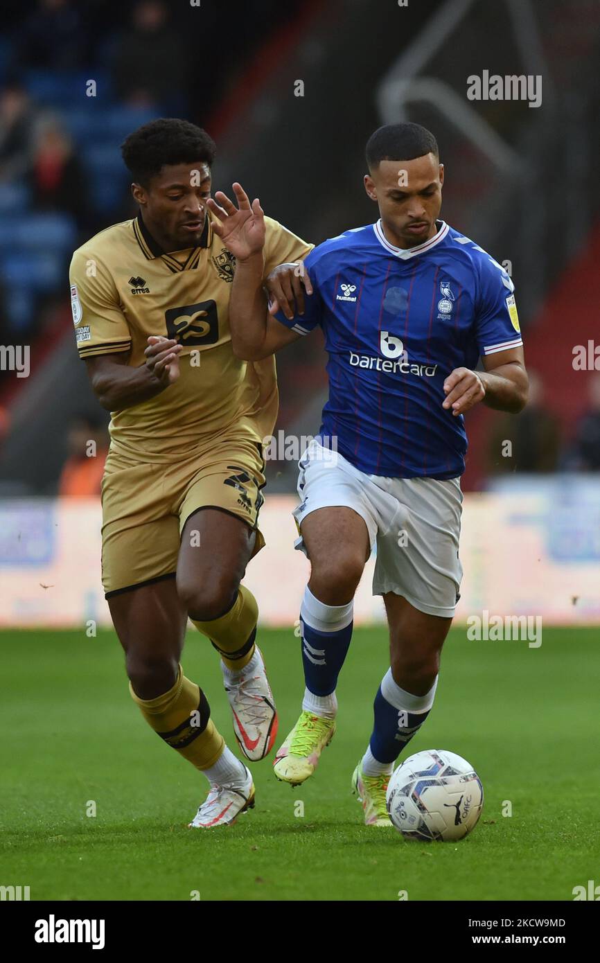 Oldham Athletic's Jordan Clarke tussles with Lewis Cass of Port Vale during the Sky Bet League 2 match between Oldham Athletic and Port Vale at Boundary Park, Oldham on Saturday 20th November 2021. (Photo by Eddie Garvey/MI News/NurPhoto) Stock Photo