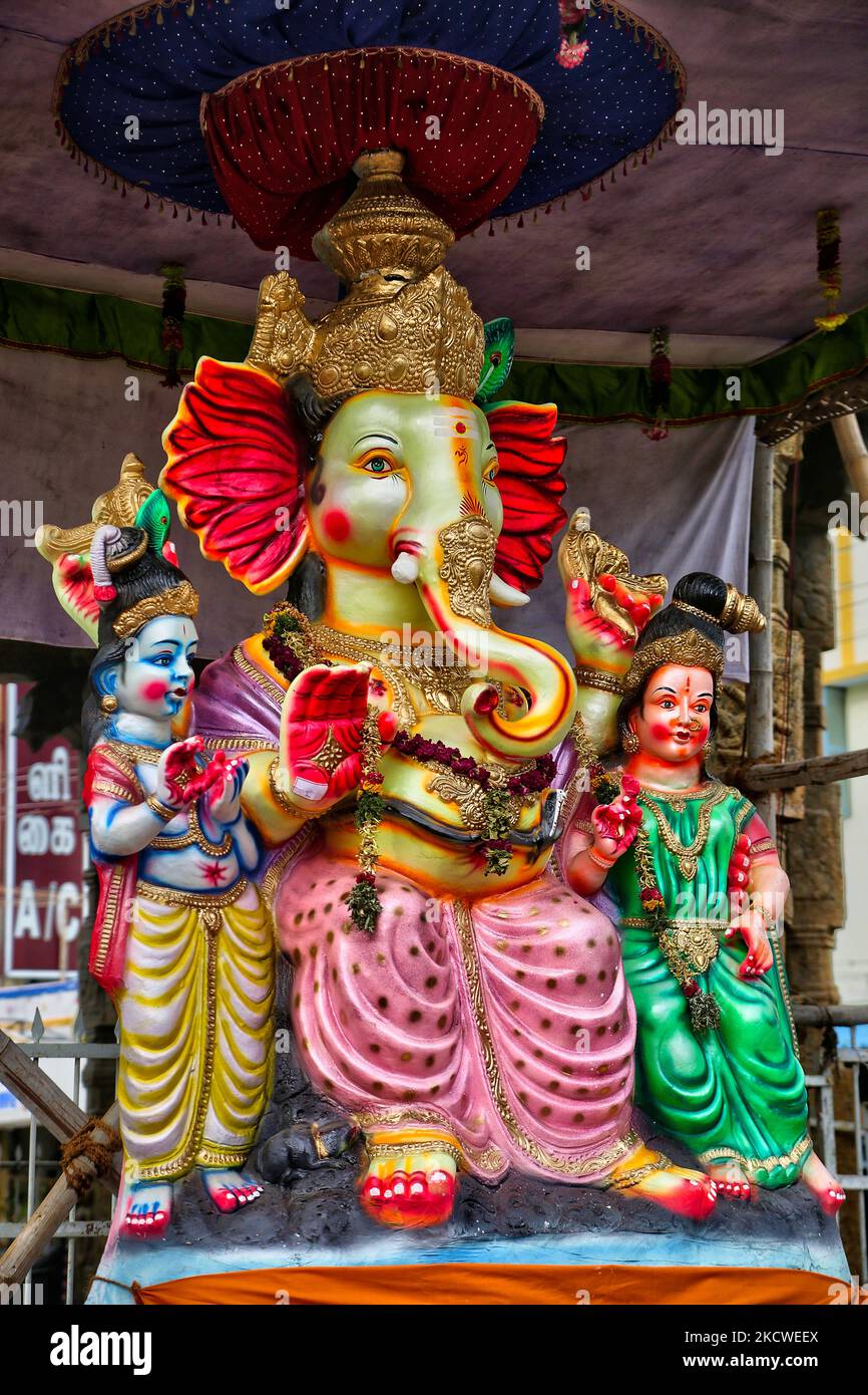 Large clay idols of Lord Ganesha (Lord Ganesh), Lord Shiva, and Goddess Parvati at a pandal (temporary temple) along the roadside during the festival of Ganesh Chaturthi in Madurai, Tamil Nadu, India. Ganesh Chaturthi (also known as Vinayaka Chaturthi) is a Hindu festival celebrating the arrival of Ganesh to earth from Kailash Parvat with his mother Goddess Parvati. (Photo by Creative Touch Imaging Ltd./NurPhoto) Stock Photo