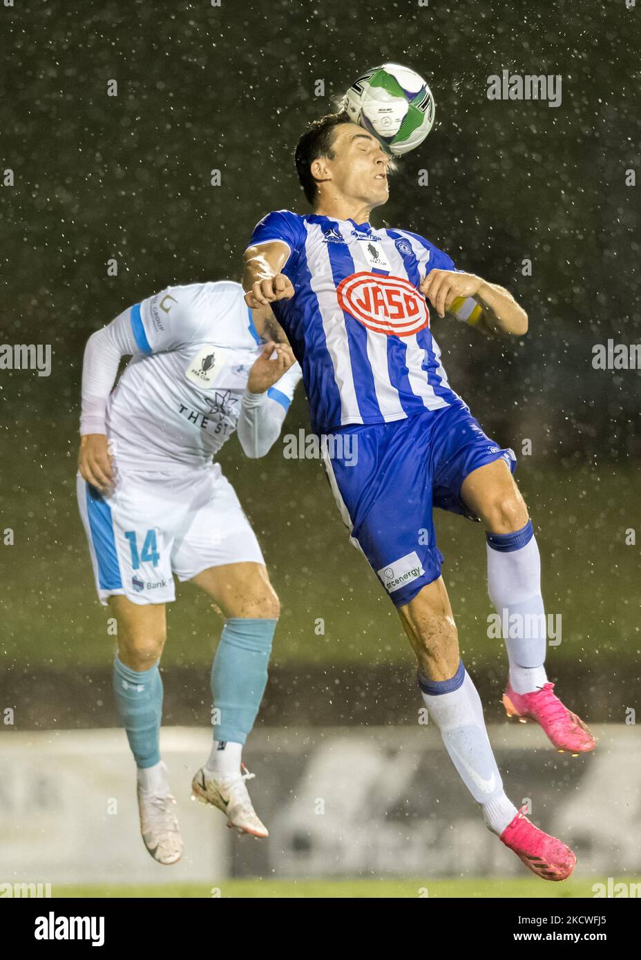 Alex Willson of Olympic FC headers the ball during the FFA Cup round of 32 match between Sydney Olympic FC and Sydney FC at Belmore Sports Ground on November 24, 2021 in Sydney, Australia. (Editorial use only) Stock Photo