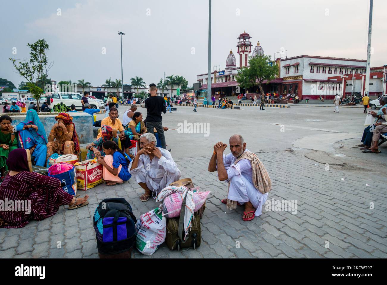 July 4th 2022 Haridwar India. Haridwar railway Station building with people sitting all around in waiting. Stock Photo
