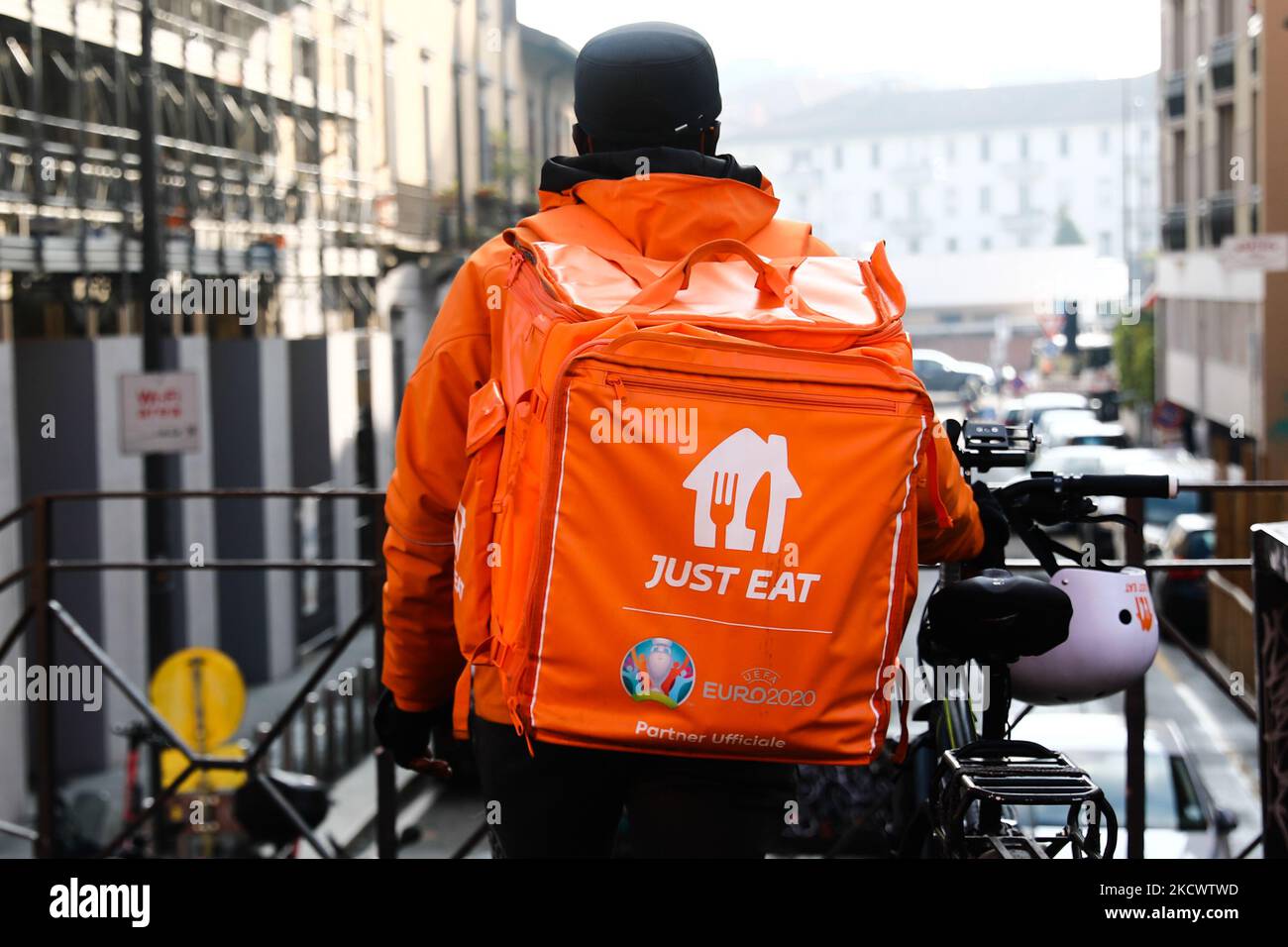 Just Eat logo is seen on a courier's bag at the Navigli in Milan, Italy on November 26, 2021. (Photo by Jakub Porzycki/NurPhoto) Stock Photo