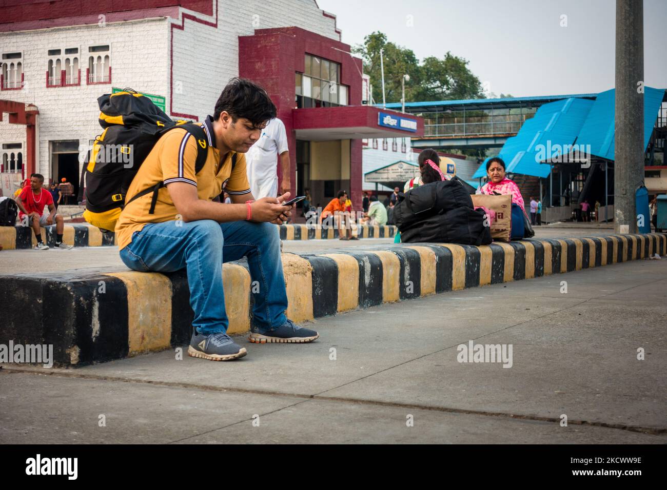 July 4th 2022 Haridwar India. A man with a backpack waiting for the train at the Haridwar railway Station. Stock Photo