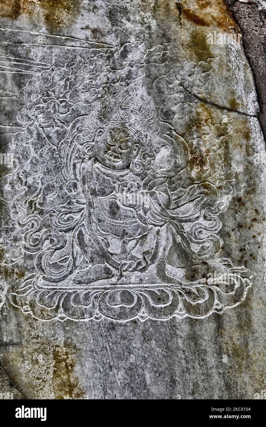 An ancient stone carving with the image of a Buddhist deity at a religious shrine among the ruins of Rabdentse Palace in Rabdentse Sikkim, India on June 02, 2010. Towards the reign of Tenzing Namgyal, the frequent Gorkha attack from the western boarder finally caused the capital to be shifted. Rabdentse was acknowledged to be the second capital of Sikkim. With passing time, Rabdentse was desolated and ravages of time and the royal capital turned into ruins. The site has been recently very fully excavated and restored by the Archaeological survey of India. (Photo by Creative Touch Imaging Ltd./ Stock Photo