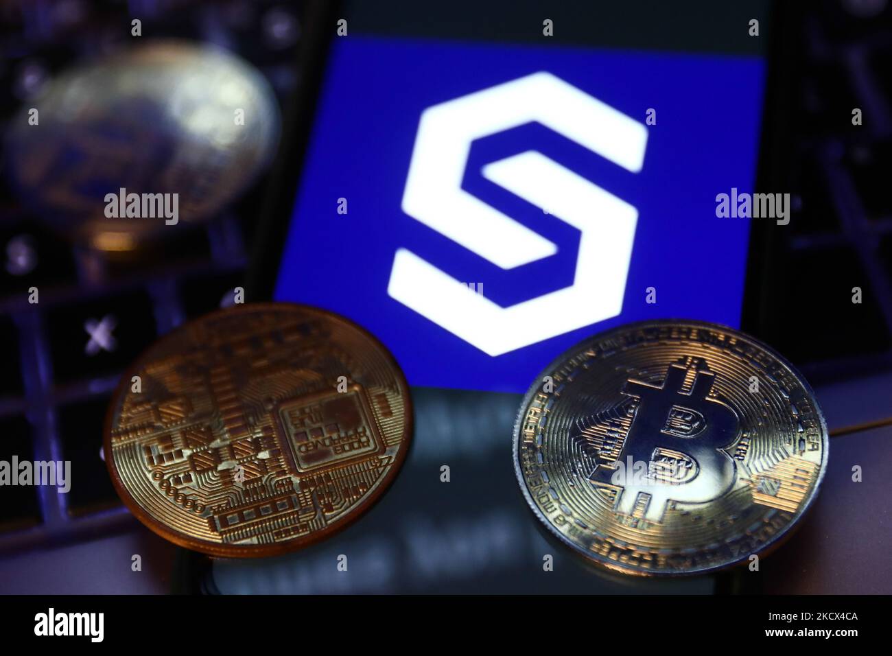 Representation of Bitcoin cryptocurrency and Coinstore logo displayed on a  phone screen are seen in this illustration photo taken in Krakow, Poland on  December 1, 2021. (Photo by Jakub Porzycki/NurPhoto Stock Photo -