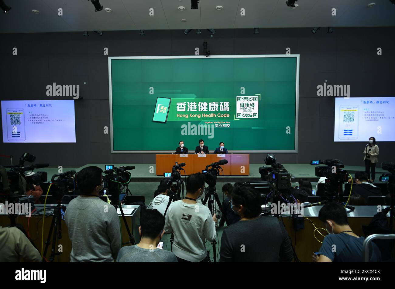 From Left to Right Victor Lam Government Chief Information Officer, Alfred Sit Secretary for Innovation and Technology and Mr Tong Wong, Deputy Government Chief Information Officer speaks during a press conference on the Hong Kong Health Code , December 2, 2021 in Hong Kong. Today the Government announced its the Hong Kong Health code which will be used for Quarantine free travel with Mainland China, Hong Kong has the strictest quarantine policies in the World with travelers arriving from most parts of the world requires to undergo a hotel quarantine of 21 days. (Photo by Vernon Yuen/NurPhoto) Stock Photo