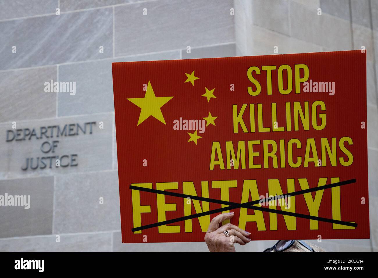 Demonstrators gather at the Department of Justice building in Washington, D.C. on December 3, 2021 to urge the government to criminally prosecute the Sackler family, the owners of Purdue Pharma, whom many say are chiefly responsible for the opioid crisis in the United States (Photo by Bryan Olin Dozier/NurPhoto) Stock Photo