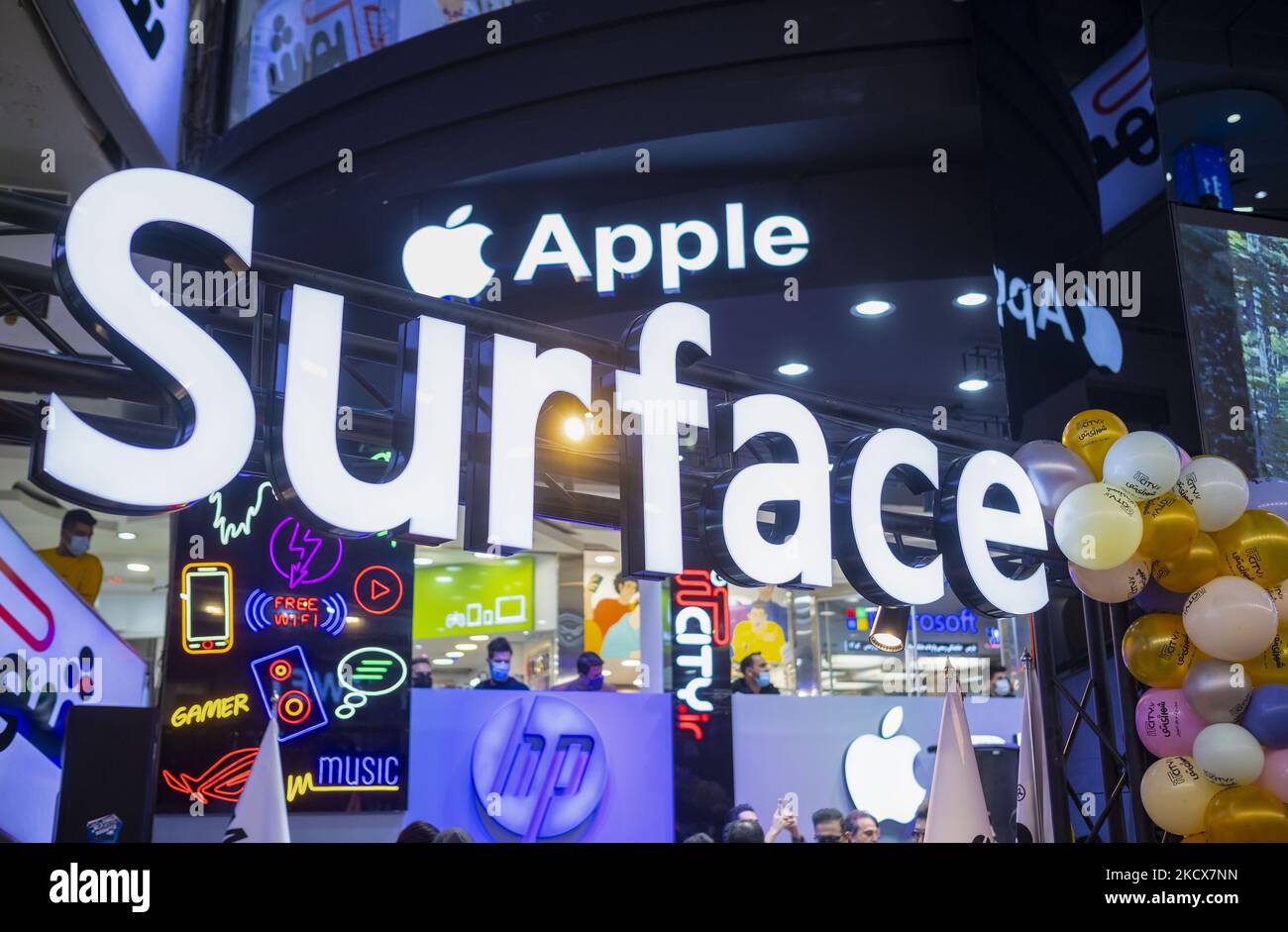 Logos of the American high-Technology maker companies such as Apple, Microsoft and the hp are pictured in the IT-City multi brand shop at the Paytakht computer centre in northern Tehran on December 1, 2021. Despite US sanctions against Iran, Iranians have access to the latest technology in the world of telecommunications and digital, but in most cases at a higher price than the global value of technology goods, but the Iranians prefer to keep themselves update themselves in the field of the computers and telecommunication technology. Even though they have to have to get loan to buy a new smart Stock Photo