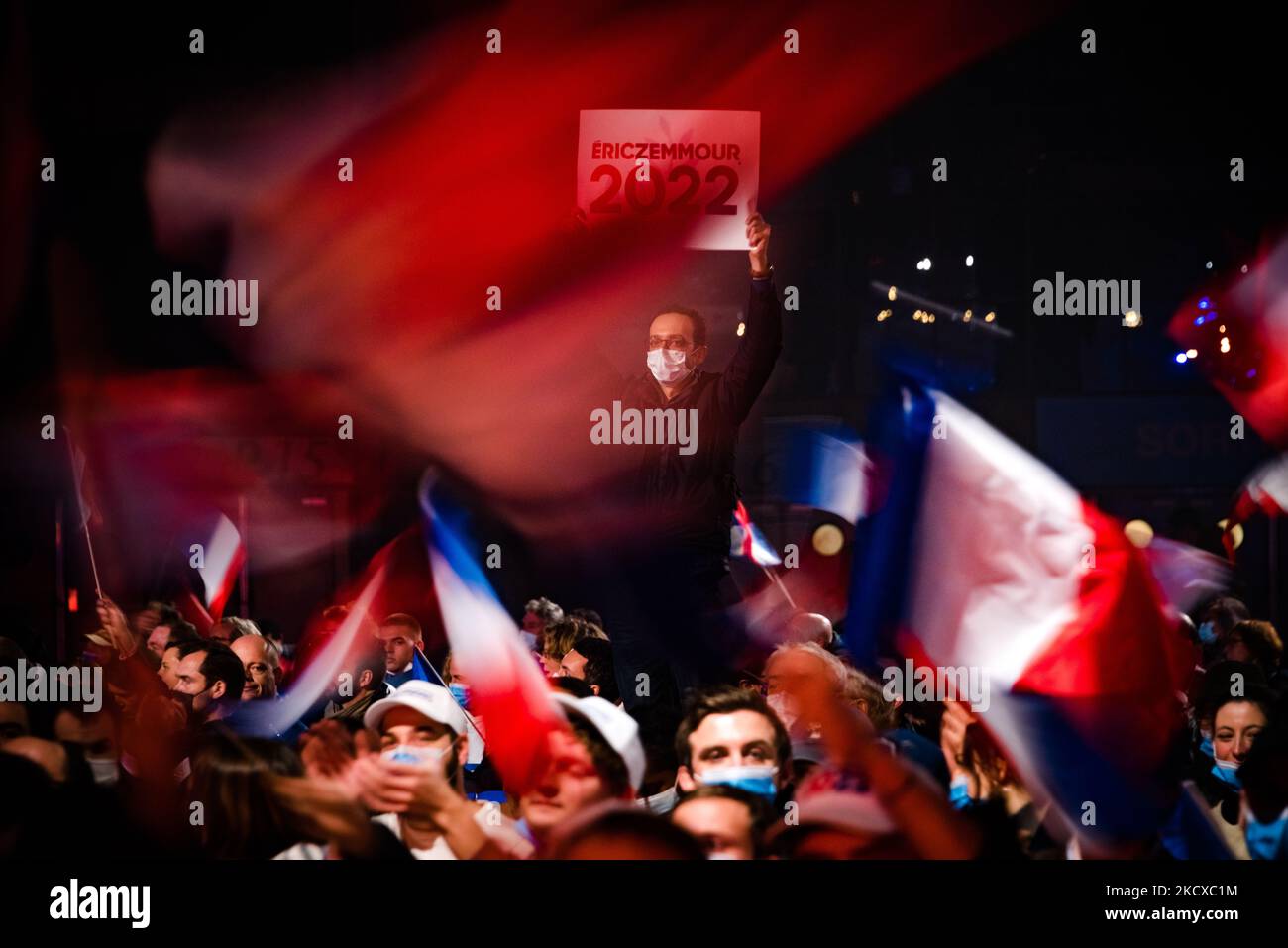 Several thousand people gathered in Villepinte (suburb of Paris) on December 5, 2021 for the first meeting in the 2022 presidential race of former journalist and far-right polemicist Eric Zemmour. Hundreds of French flags and signs with the slogans of his campaign (well, impossible is not French and Zemmour 2022) had been distributed to his activists. (Photo by Samuel Boivin/NurPhoto) Stock Photo