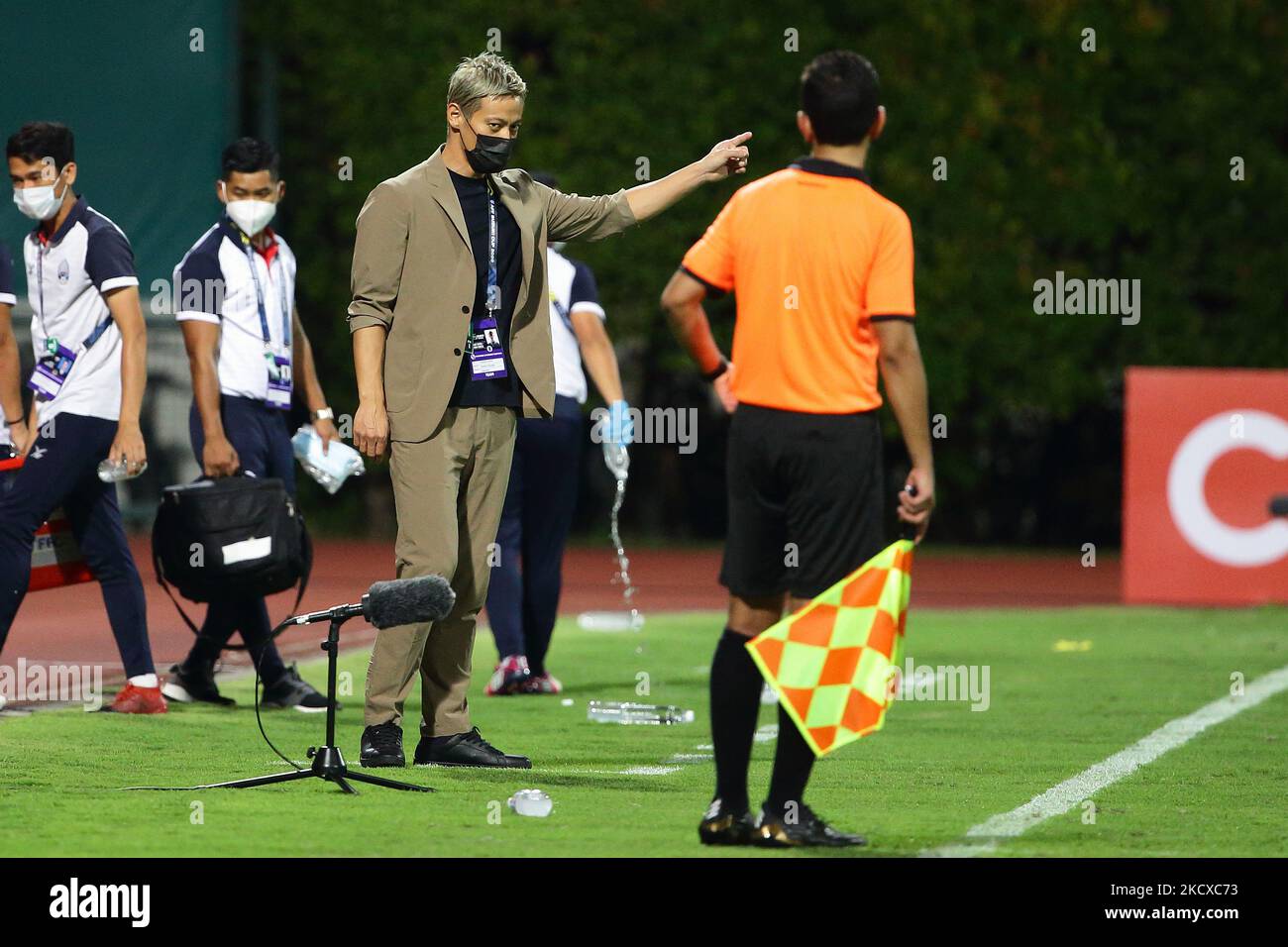 Cambodia general manager, Keisuke Honda gestures at the official during the AFF Suzuki Cup 2020 Group B match between Cambodia and Malaysia at Bishan Stadium on December 6, 2021 in Singapore. (Photo by Suhaimi Abdullah/NurPhoto) Stock Photo