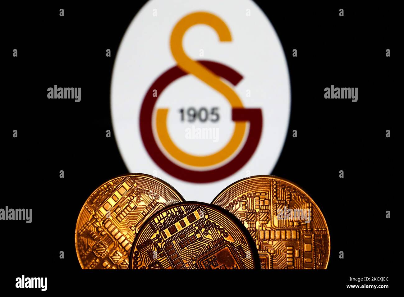 Representation of cryptocurrency is seen with Galatasaray Istanbul football club logo displayed in the background in this illustration photo taken in Krakow, Poland on December 10, 2021. (Photo by Jakub Porzycki/NurPhoto) Stock Photo