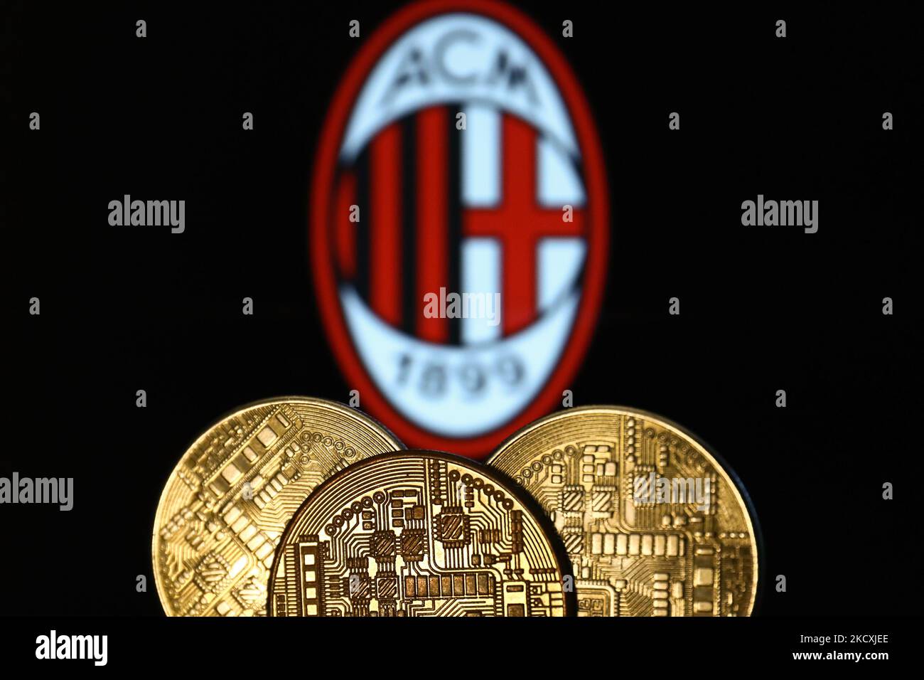 Representation of cryptocurrency is seen with AC Milan football club logo  displayed in the background in this illustration photo taken in Krakow,  Poland on December 10, 2021. (Photo by Jakub Porzycki/NurPhoto Stock