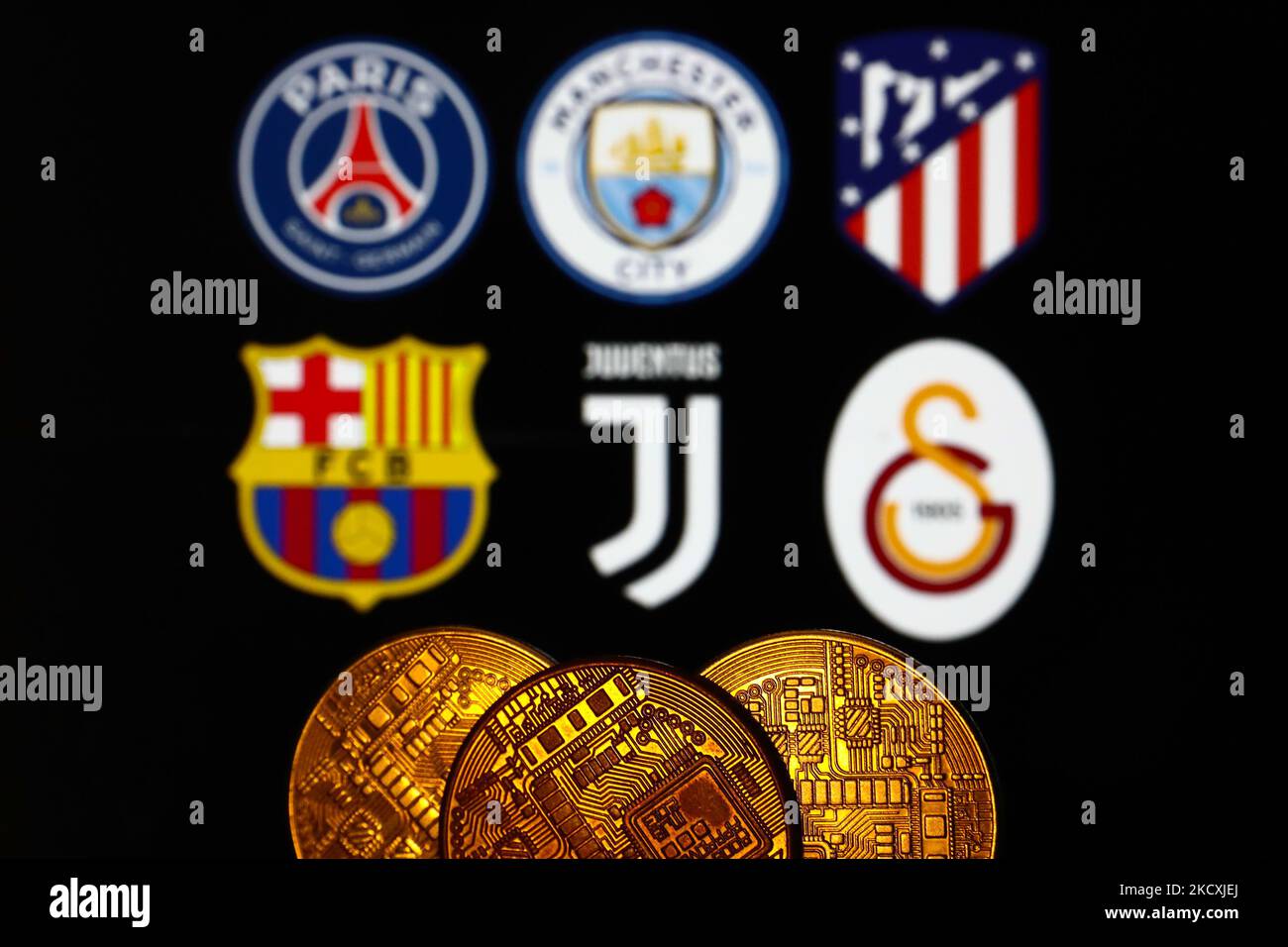 Representation of cryptocurrency is seen with logos of some of the football clubs, that have their own token coins, displayed in the background in this illustration photo taken in Krakow, Poland on December 10, 2021. (Photo by Jakub Porzycki/NurPhoto) Stock Photo