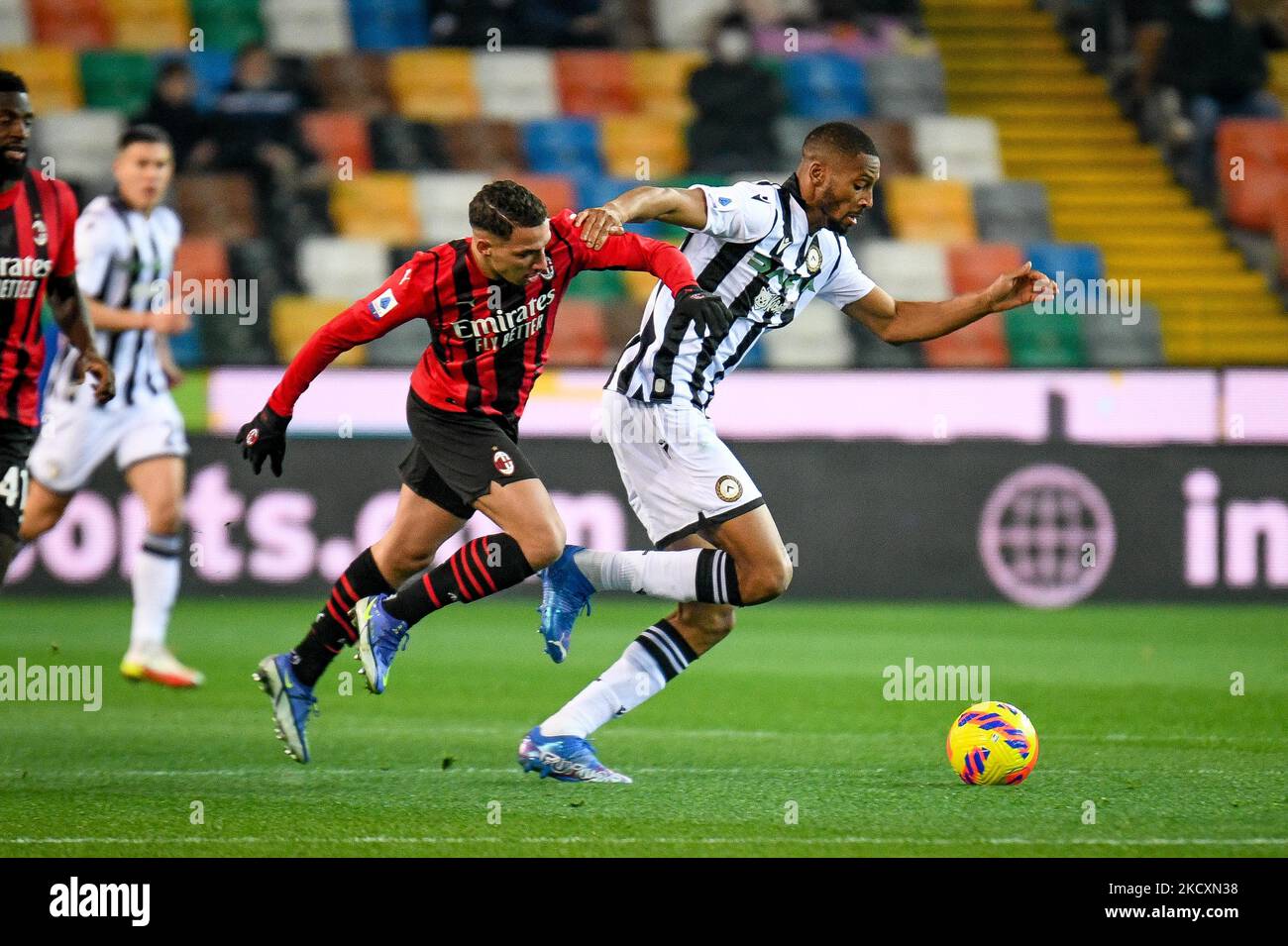 Udinese's Norberto Bercique Gomes Betuncal in action against Milan's Ismael Bennacer (Milan) during the italian soccer Serie A match Udinese Calcio vs AC Milan on December 11, 2021 at the Friuli - Dacia Arena stadium in Udine, Italy (Photo by Ettore Griffoni/LiveMedia/NurPhoto) Stock Photo