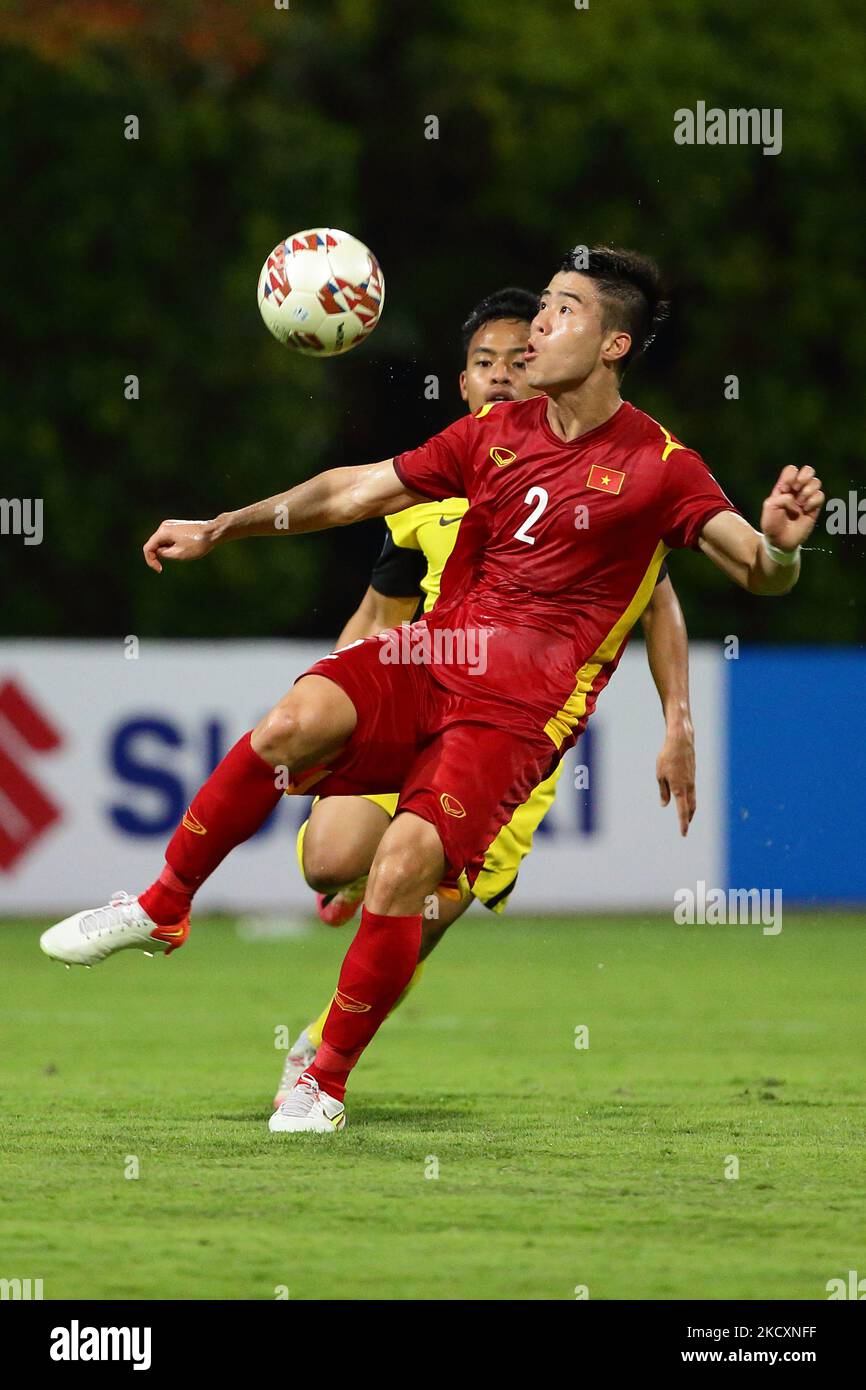 Do Duy Manh of Vietnam (front) shields the ball from Luqman Hakim Bin ...