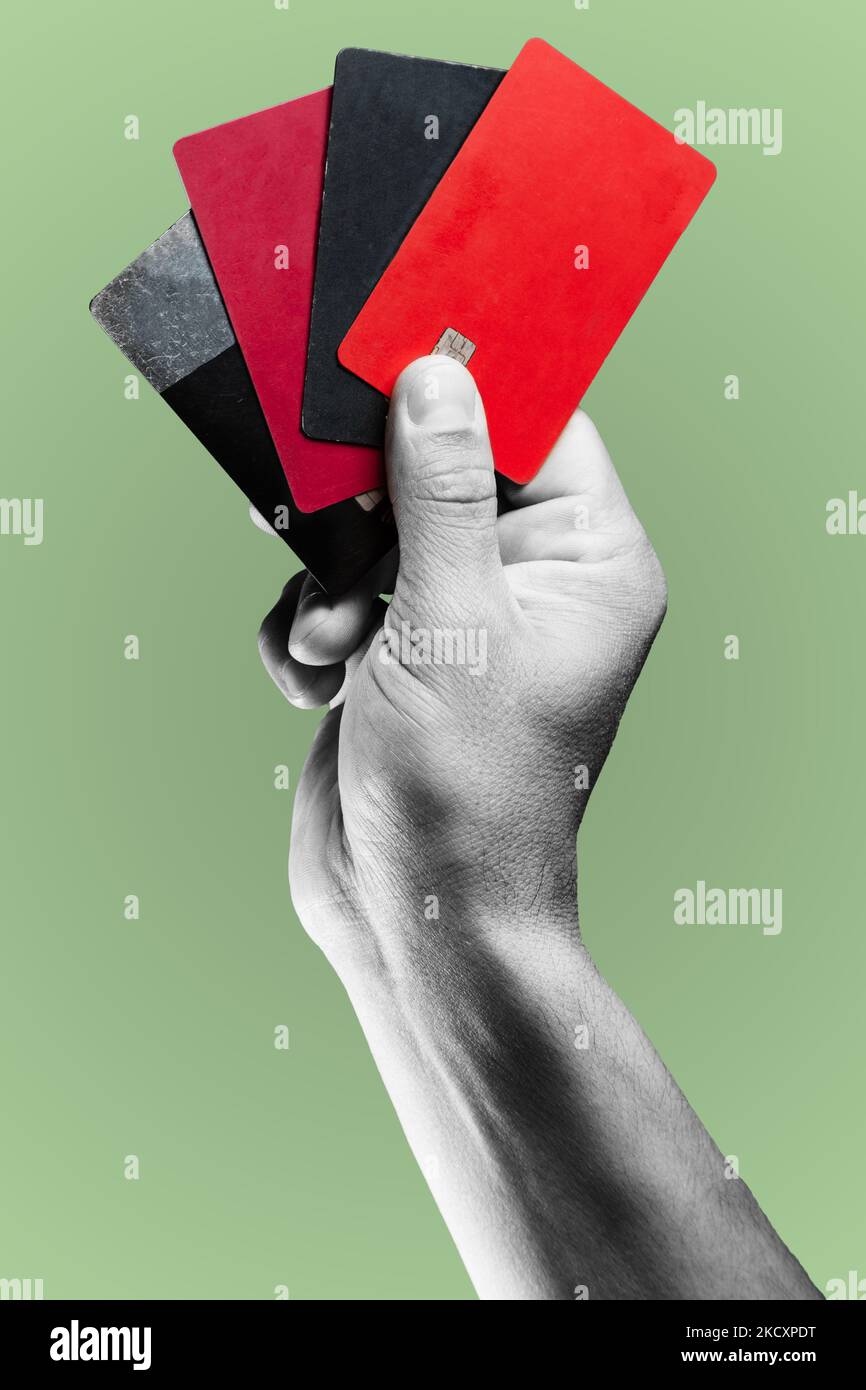 Man's hand holding credit cards. Stock Photo