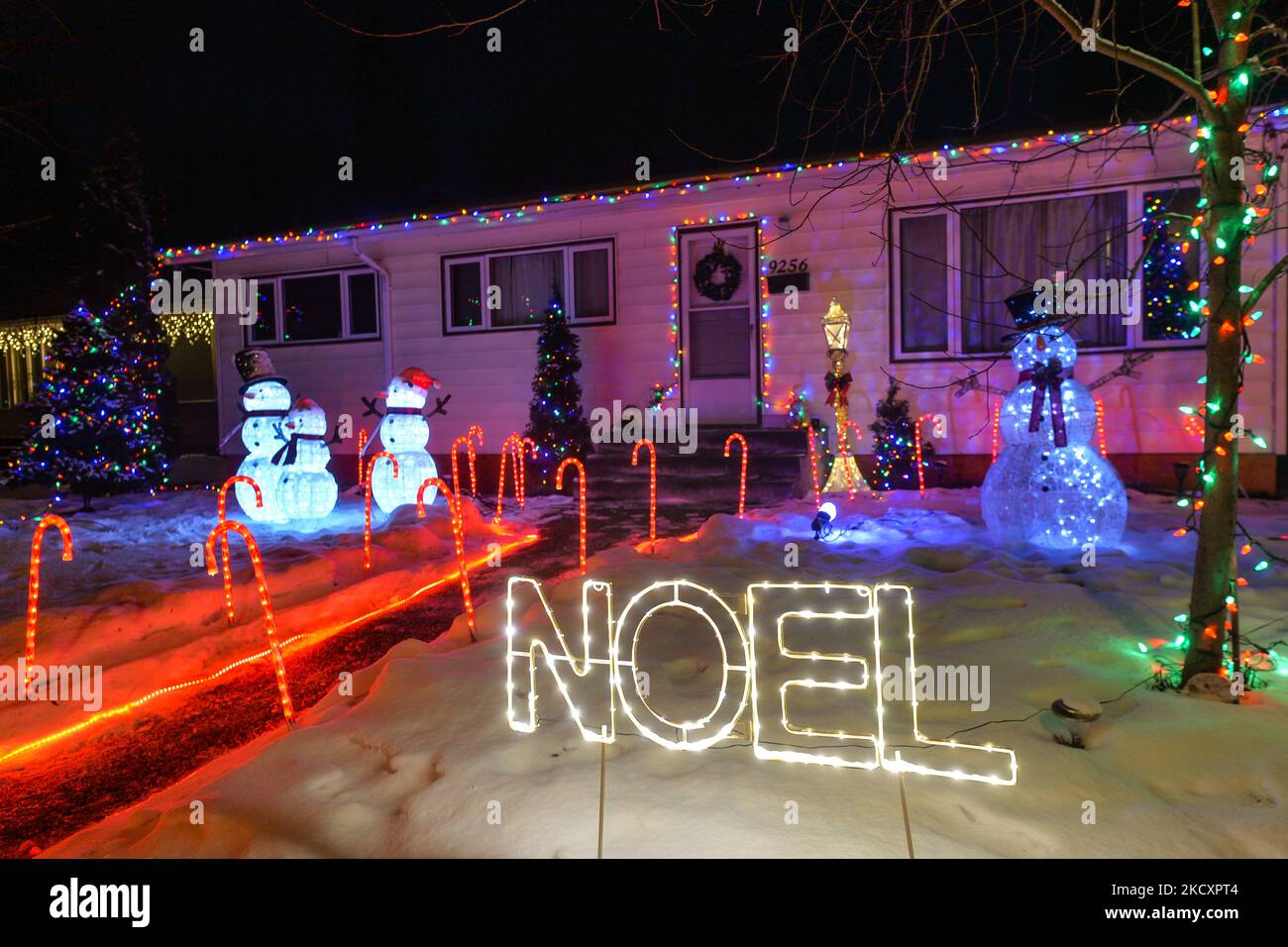 Christmas decorations in front of the house in Candy Cane Lane, a Christmas decorations in front of the house in Candy Cane Lane, a