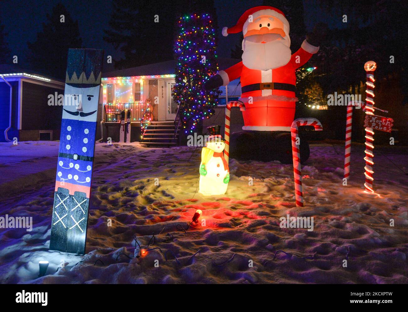 Christmas decorations in front of the house in Candy Cane Lane, a