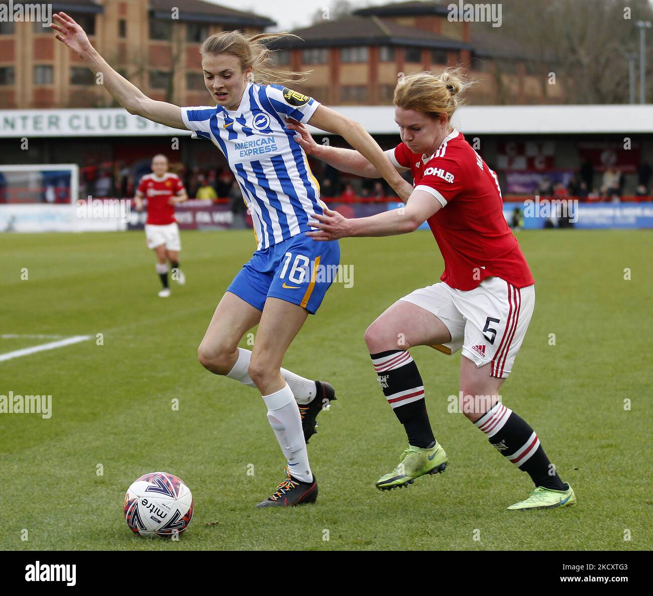 Aoife Mannion of Manchester United Women and Ellie Brazil of Brighton & Hove Women during Barclays FA Woman Super League between Brighton and Hove Albion and Manchester United at The People's Pension Stadium, Crawly on 12th December, 2021 (Photo by Action Foto Sport/NurPhoto) Stock Photo