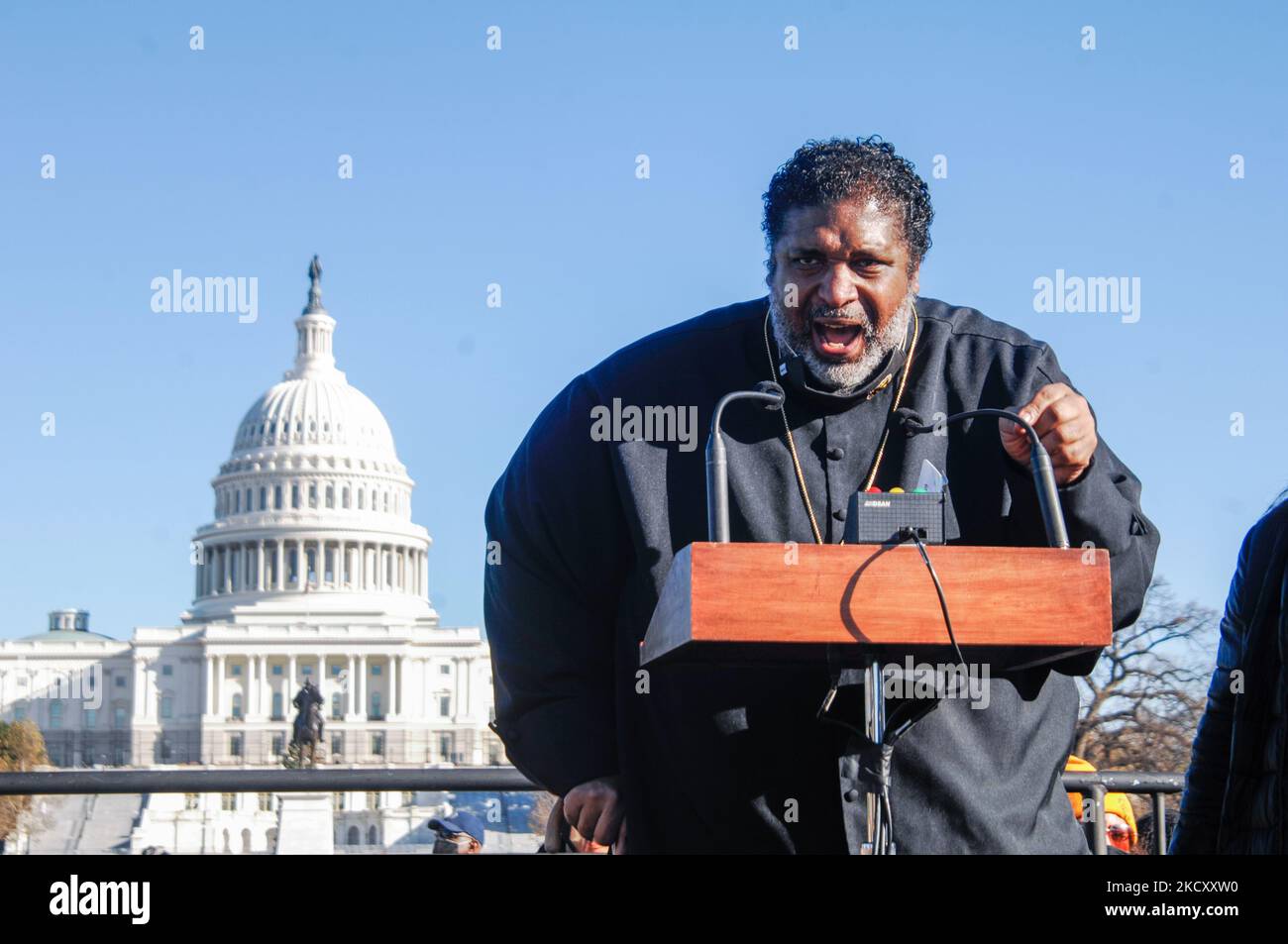 Rev. William Barber calls out political leaders on the left and right for their refusal to act on policies that enjoy the support of the majority of Americans even as Americans in a time of need during a rally in front of the U.S. Capitol in Washington D.C. on December 13, 2021. (Photo by Cory Clark/NurPhoto) Stock Photo