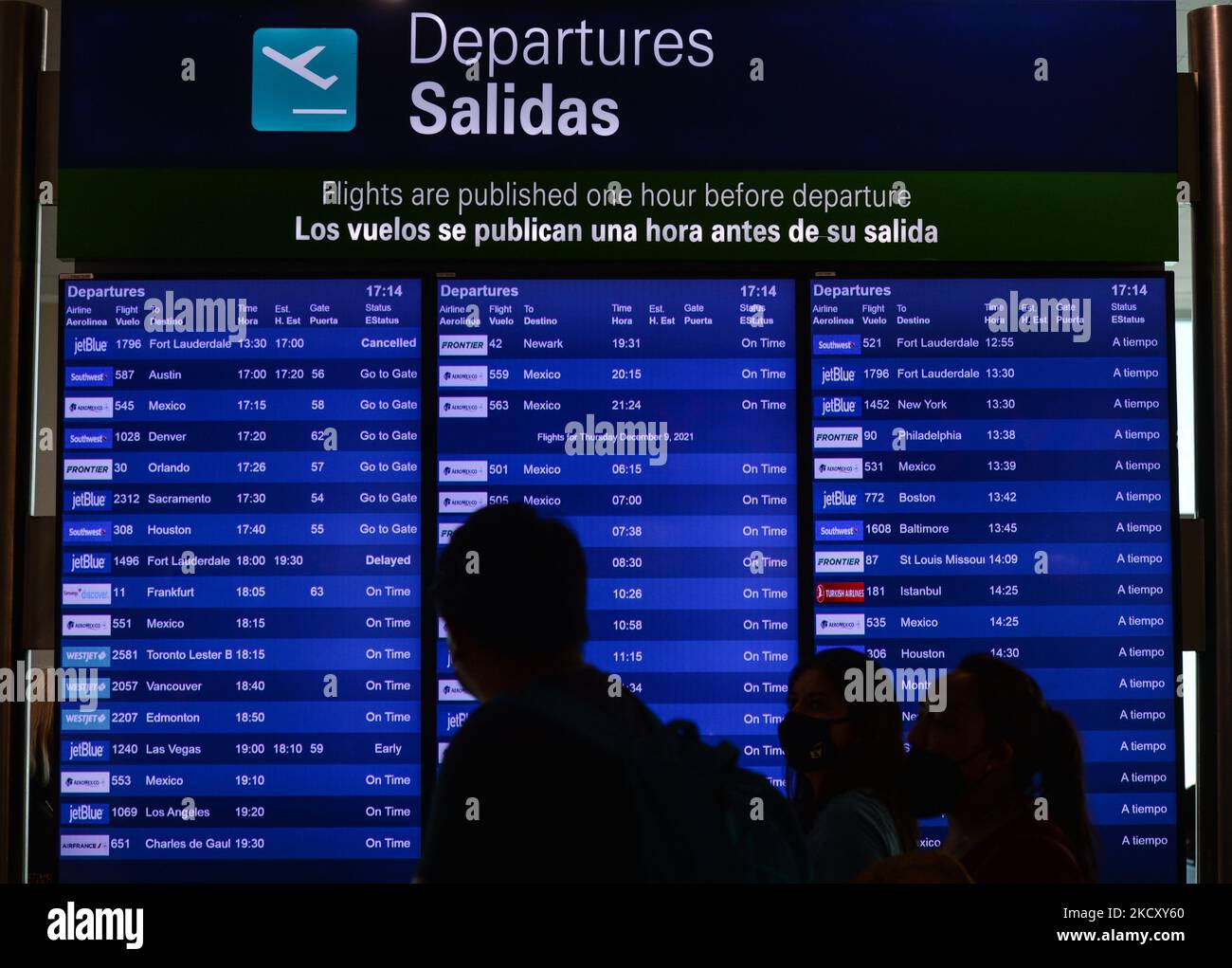 Departures information board seen at Cancun International Airport. On