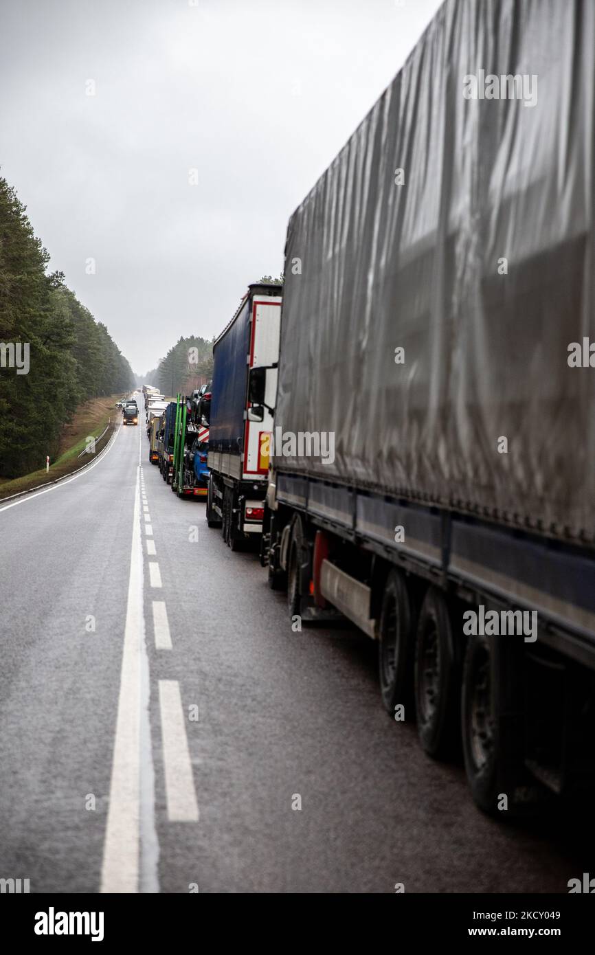 Nearly 20 kilometr line of trucks waits to cross Polish - Belarusian near Bobrownik, podlaskie voivodship, Poland on December 16, 2021. Polish government limitem the number of border crossings with Bielarus. The movement of good excelerate bezforemnego Christmas. Polish government annonced no entry zone by Polish-Bielarus border guarded by tens of thousands soldiers and police due to an infaux of immigrants, mainly from the Middle East. The border between Belarus and Poland is also the border of the European Union. Poland accuses the Lukashenko regime of orchestrating the transit of thousands  Stock Photo