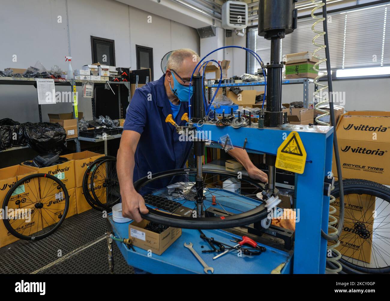 An employee of Wilier Triestina inspects and assembles parts of a bicycle at a modern plant in Rossano Veneto. Wilier Triestina is an Italian manufacturer of racing bicycles, founded in 1906 by Pietro Dal Molin in Bassano del Grappa. On Thursday, October 14, 2021, in Rossano Veneto, Veneto, Italy. (Photo by Artur Widak/NurPhoto) Stock Photo