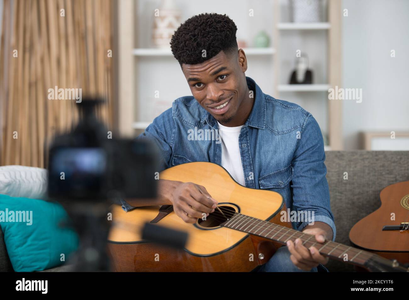 handsome man recording song vlogging concept Stock Photo