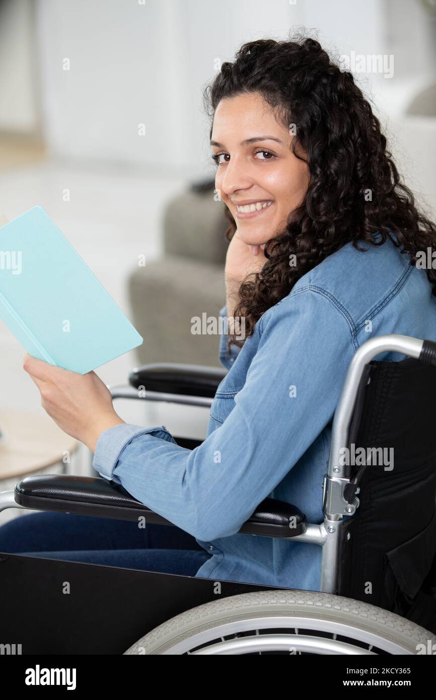 smiling young woman in wheelchair Stock Photo - Alamy