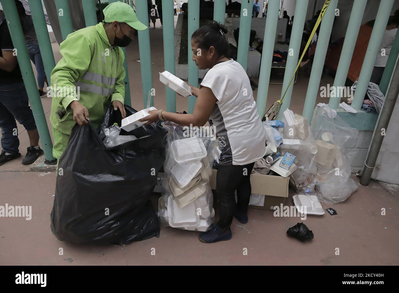 Members of the migrant caravan and clean-up workers separate rubbish at the Casa Peregrino in Mexico City during their temporary stay in the capital. (Photo by Gerardo Vieyra/NurPhoto) Stock Photo