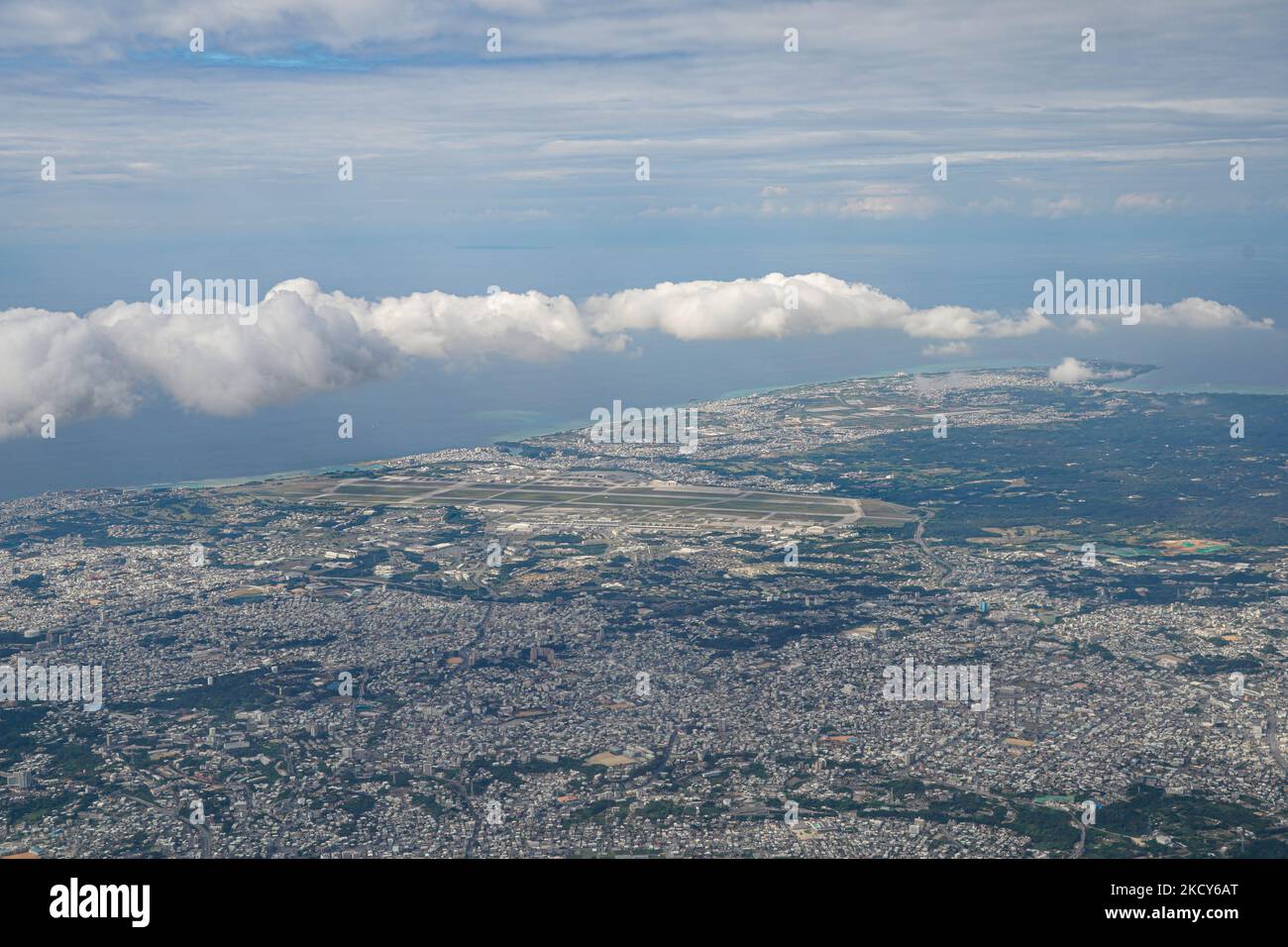 In an aerial view of central Okinawa Island, US Kadena Air Base is seen ...