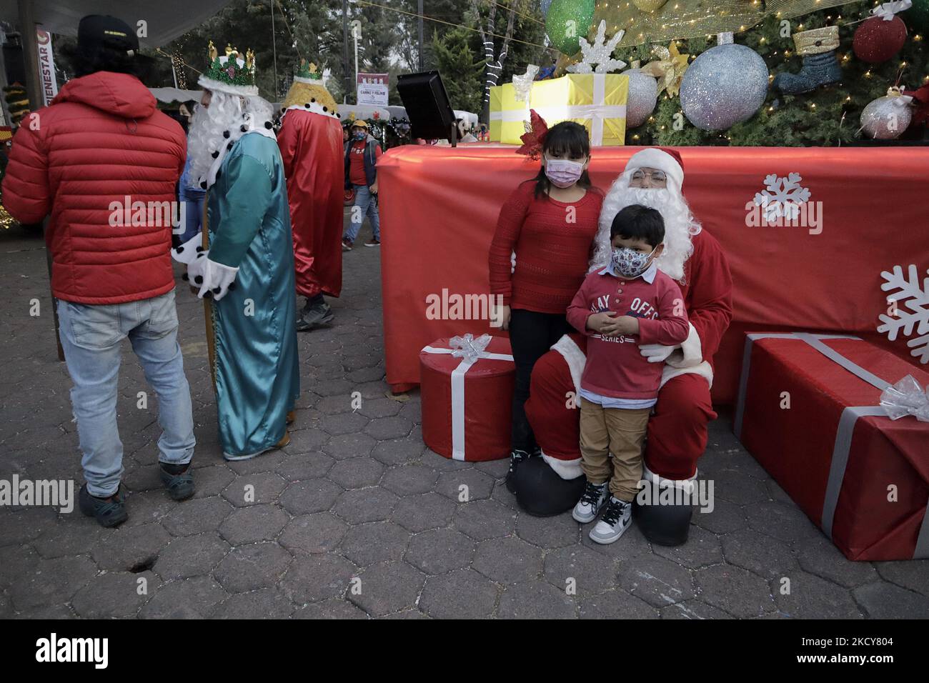 A Person Dressed As Father Christmas In A Christmas Village On The a-person-dressed-as-father-christmas-in-a-christmas-village-on-the