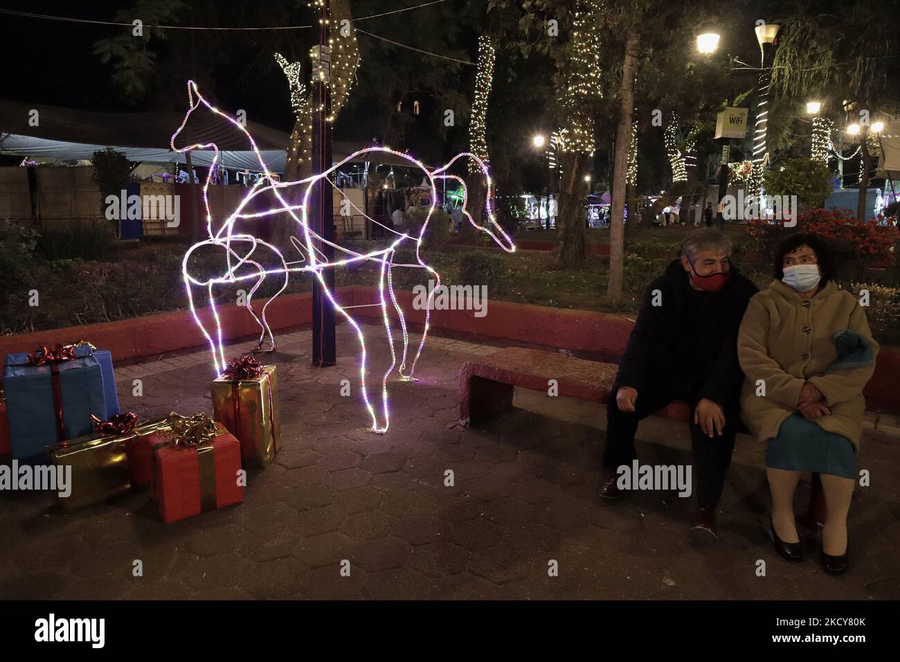 Visitors at a Christmas village located on the esplanade of the Tláhuac