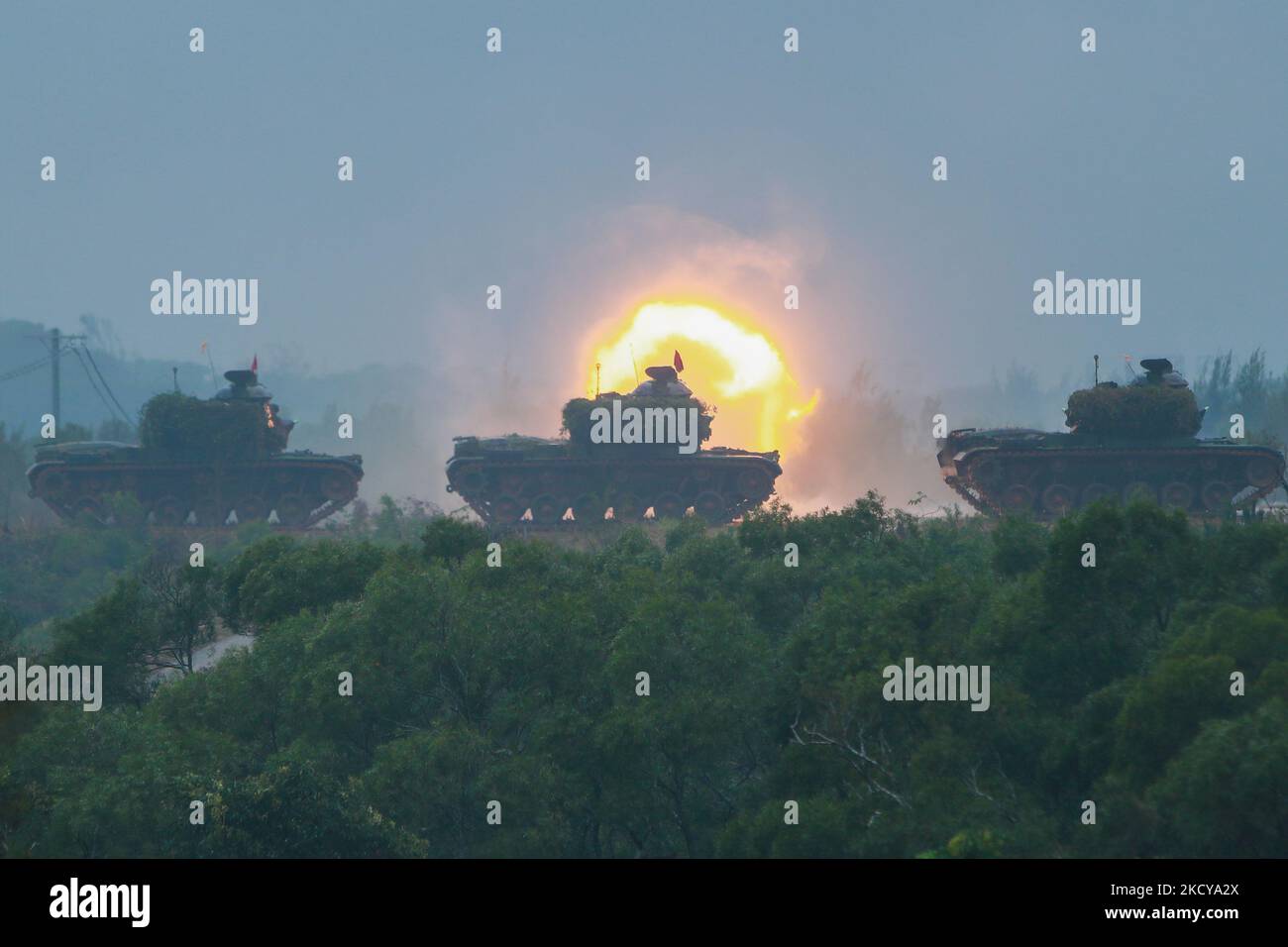 M60-A3 tanks fire cannons during a live ammunition military drill at an unnamed location, amid rising tensions with China, in Hsinchu, Taiwan, 21 December 2021. Taiwan has been facing intensifying military threats from China including Chinese PLA warplanes sent to cruise around the island, while the US has been offering more arm sales to Taiwan. (Photo by Ceng Shou Yi/NurPhoto) Stock Photo