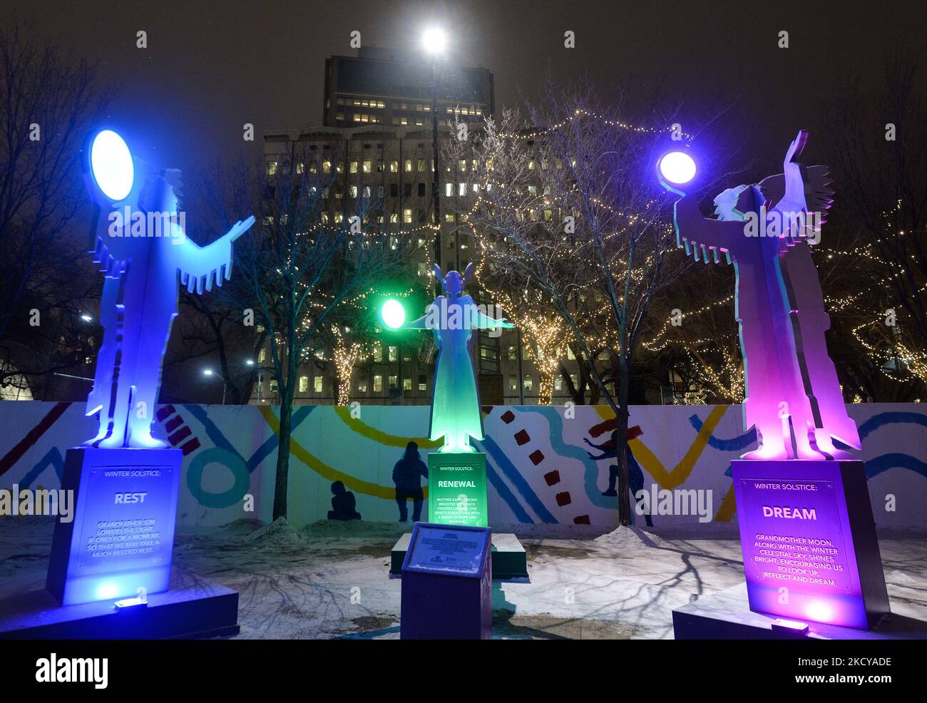 A stunning 'Winter Solstice' art installation by Edmonton-based Cree artist Jason Carter lights up Churchill Square in Edmonton to celebrate the longest and darkest night of the year. The installation consists of three 16-foot sculptures depicting Grandfather Sun, Mother Earth and Grandma Moon, labeled 'Rest', 'Renewal' and 'Dreamed' respectively, each holding a ball of light. On Tuesday, 20 October 2021, in Edmonton, Alberta, Canada. (Photo by Artur Widak/NurPhoto) Stock Photo