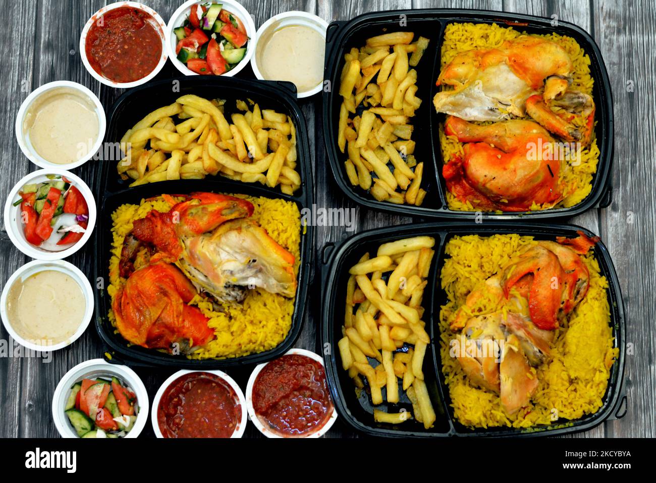 Chicken mandi kabsa with long basmati rice and french fries, served