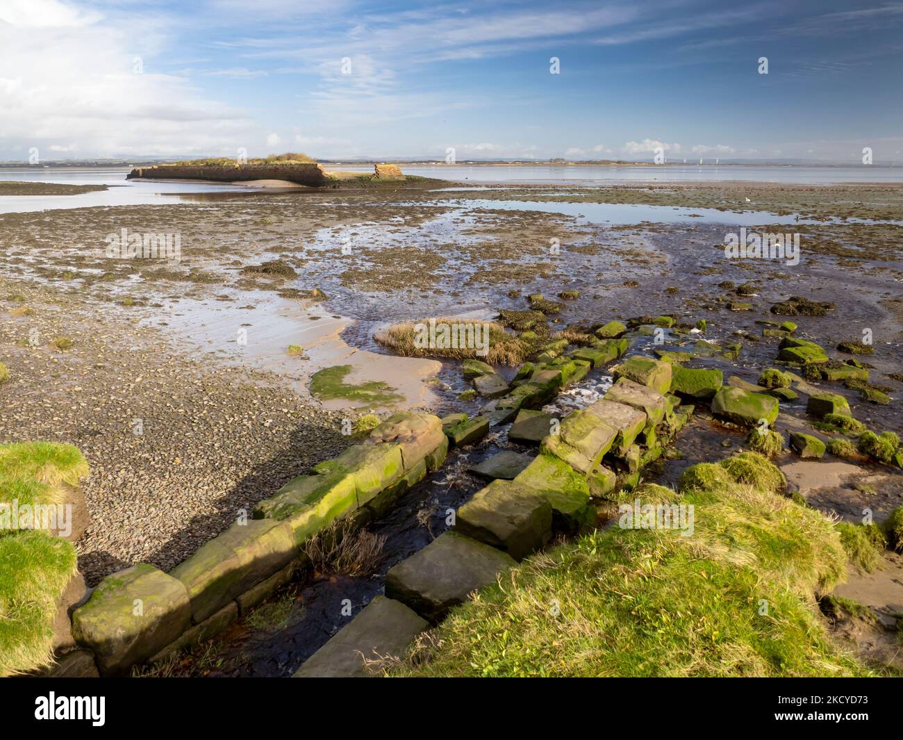 A stream emptying out into the Solway estuary at Port Carlisle in Cumbria, UK. Stock Photo
