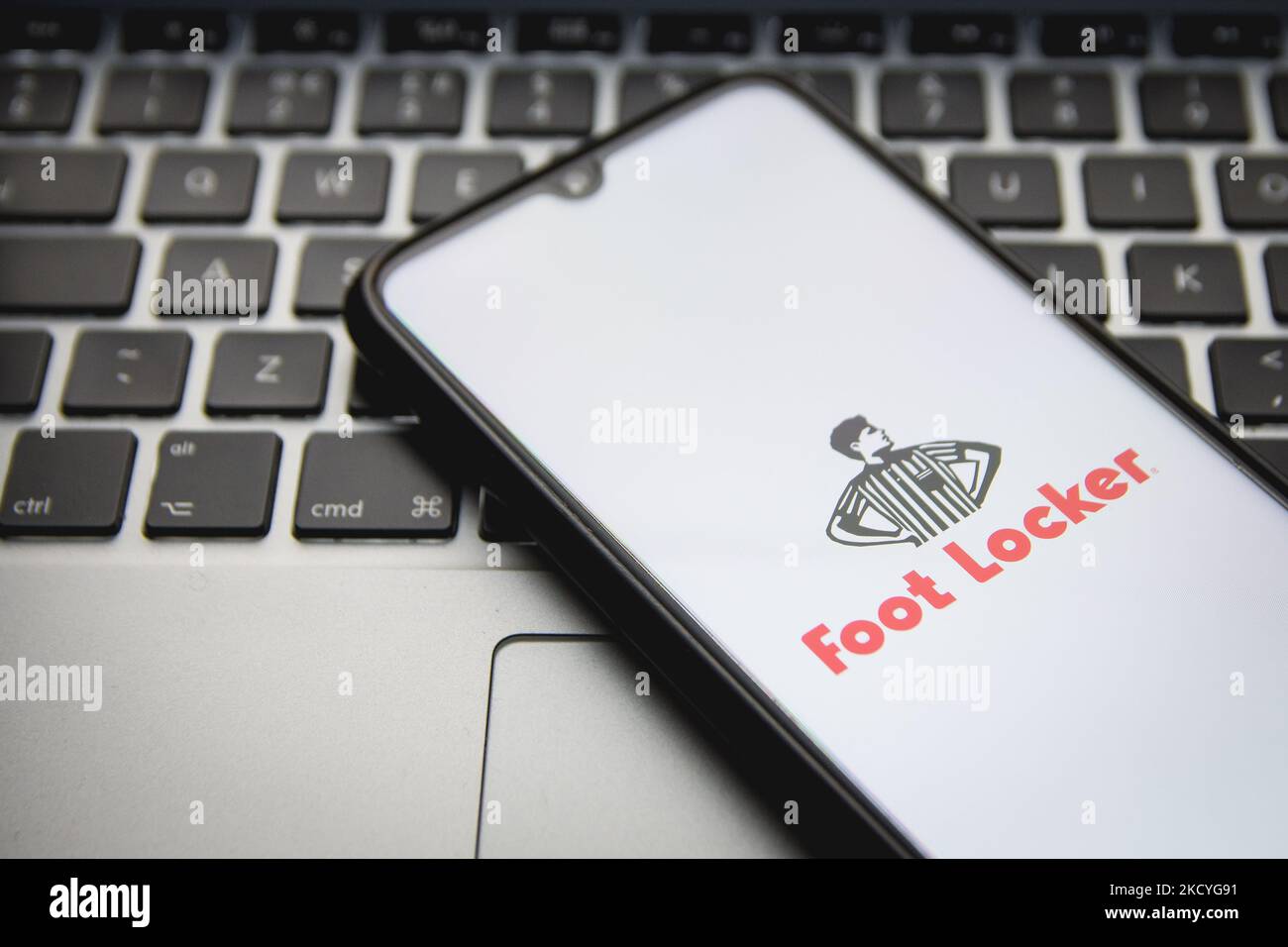 In this photo illustration a Foot Locker logo seen displayed on a smartphone screen with a computer keyword in the background in Athens, Greece on December 28, 2021. (Photo by Nikolas Kokovlis/NurPhoto) Stock Photo