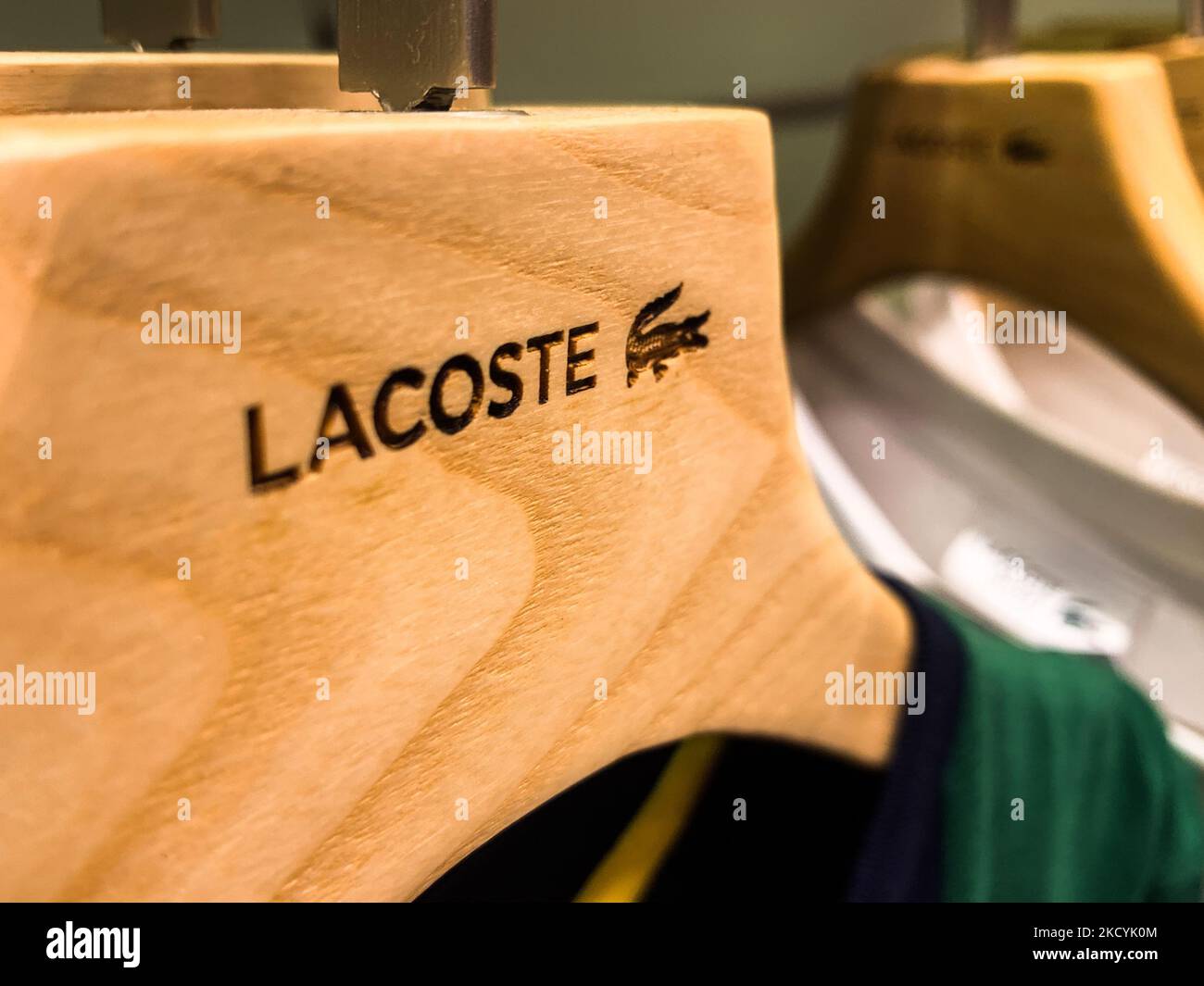 Lacoste logo is seen on clothes hanger at the store in Krakow, Poland on December 30, 2021. (Photo by Jakub Porzycki/NurPhoto) Stock Photo
