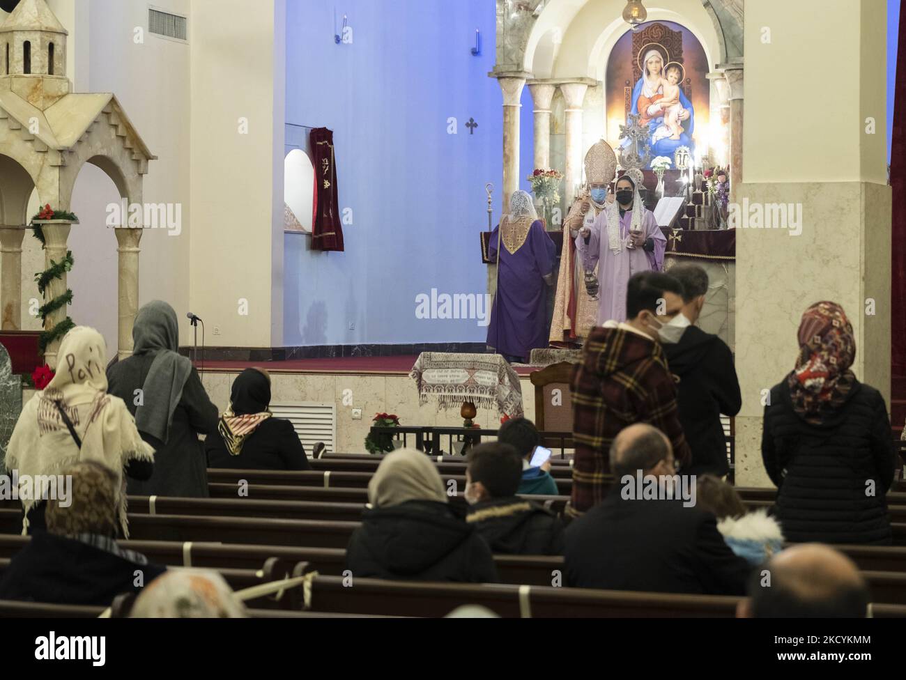 Iranian-Christian clergymen and clergywomen and Iranian-Christian people  pray during a New Year mass prayer ceremony in the Saint Sarkis church in  downtown Tehran following the new coronavirus disease (COVID-19) outbreak  in Iran,, image size:1300x976