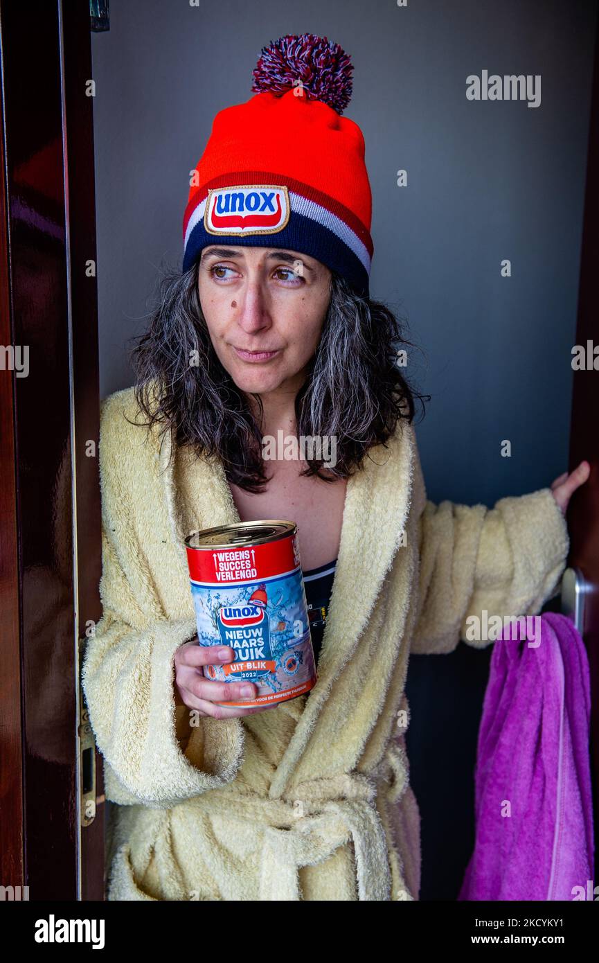 A woman is ready to celebrate the traditional New Year's dive again at home because of the pandemic. In Nijmegen, on January 1st, 2021. (Photo by Romy Arroyo Fernandez/NurPhoto) Stock Photo